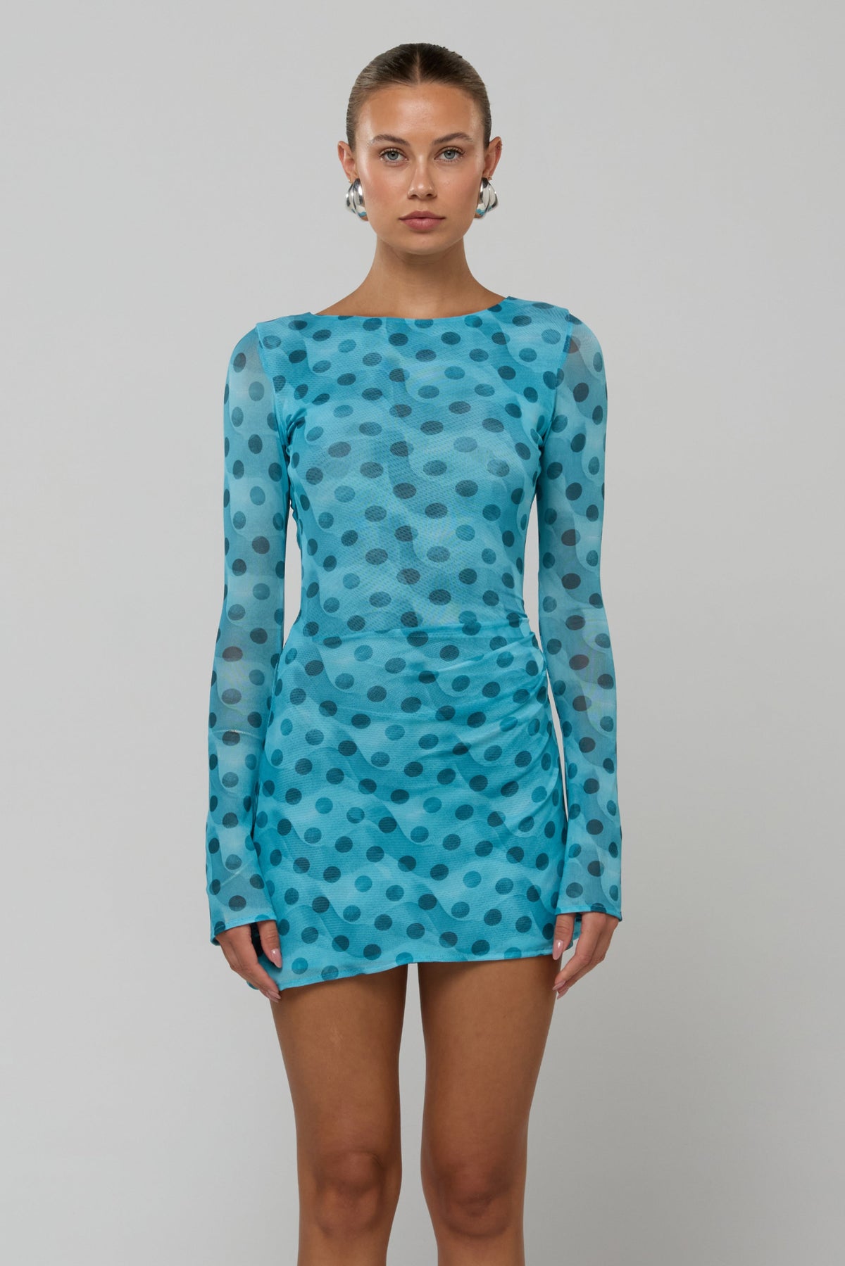 This is an image of Mia in Aquamarine - RESA featuring a model wearing the dress