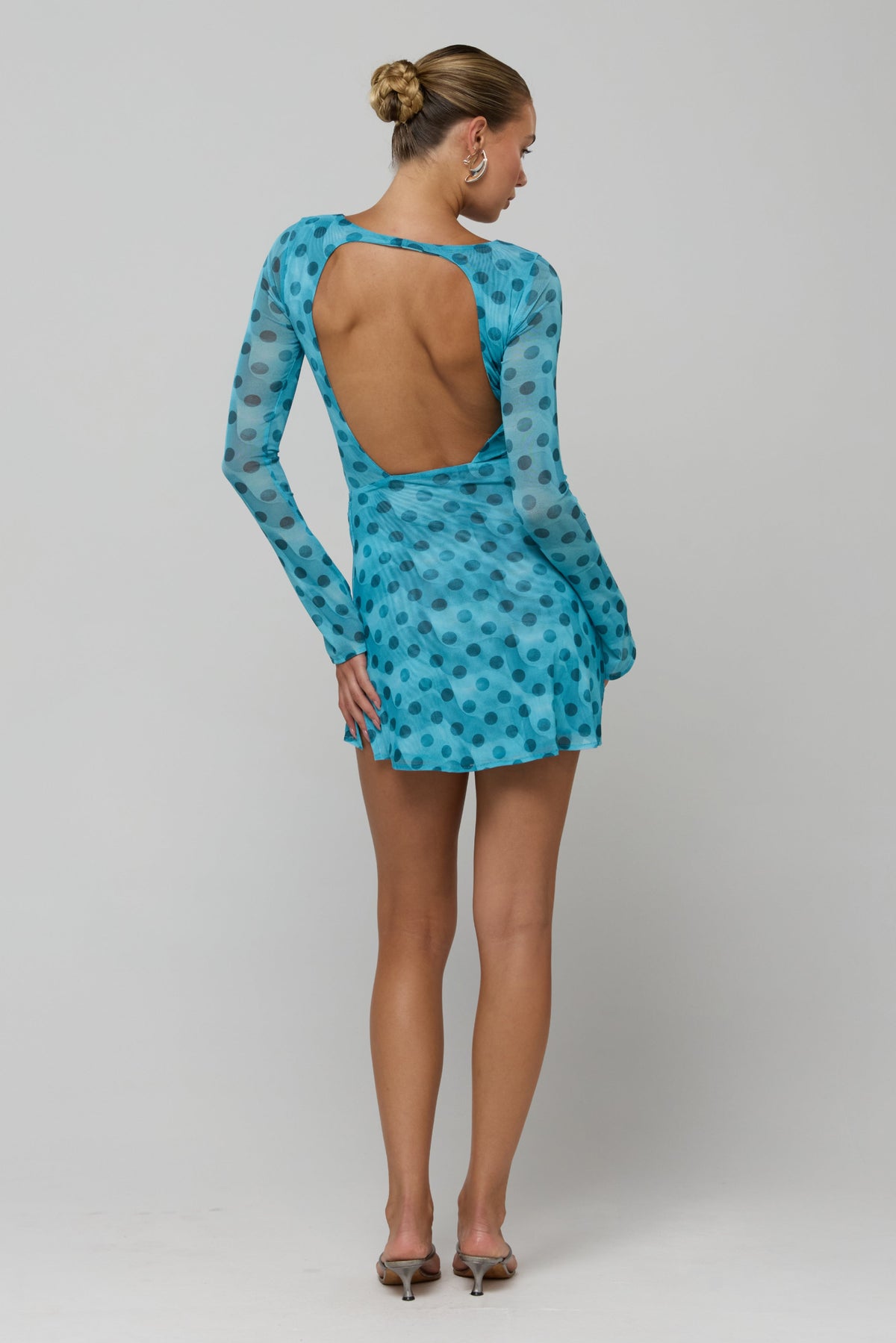 This is an image of Mia in Aquamarine - RESA featuring a model wearing the dress