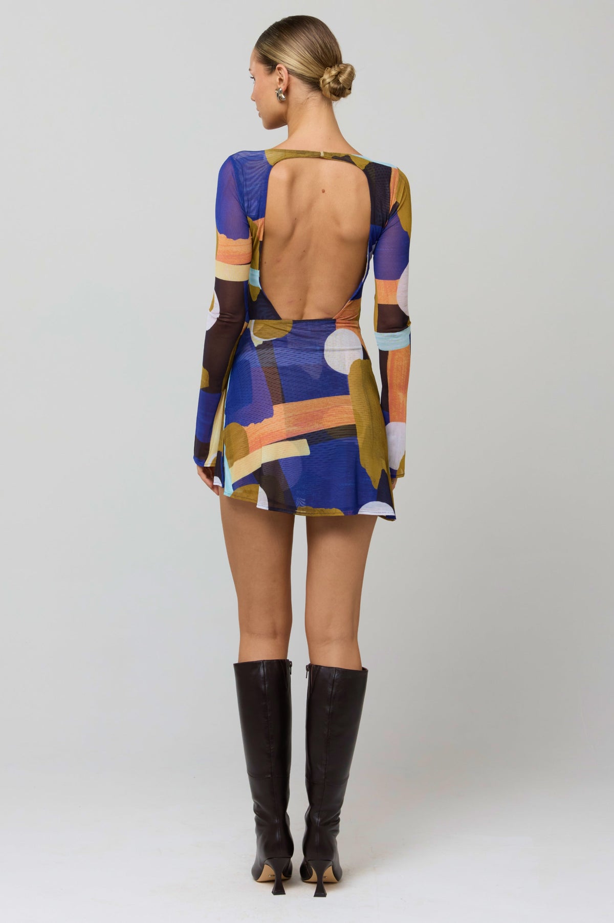 This is an image of Mia Mini Dress in Deco - RESA featuring a model wearing the dress