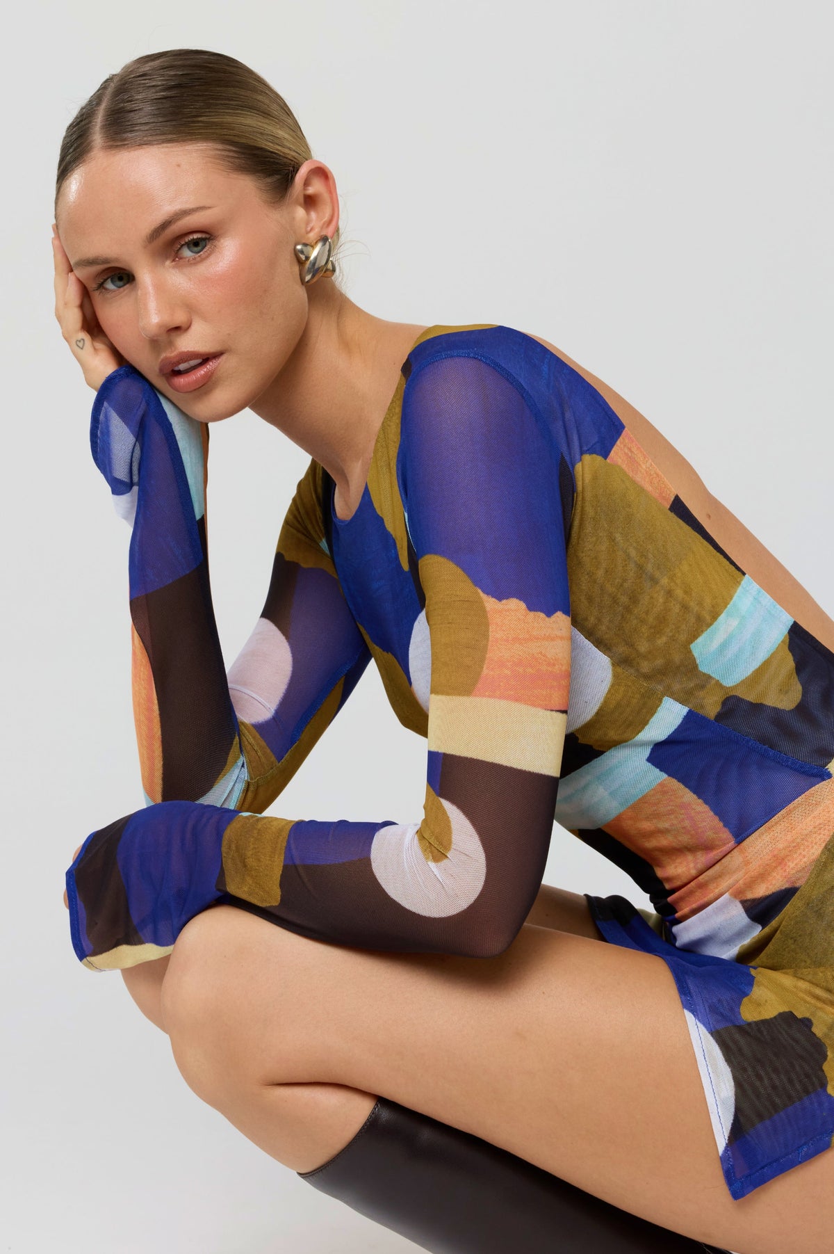 This is an image of Mia Mini Dress in Deco - RESA featuring a model wearing the dress