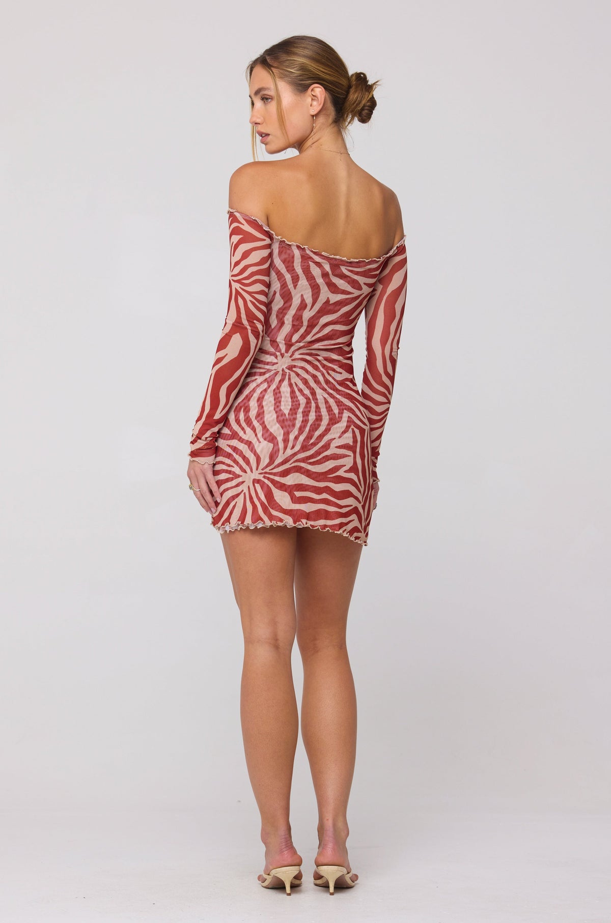 This is an image of Michelle Mini in Auburn - RESA featuring a model wearing the dress