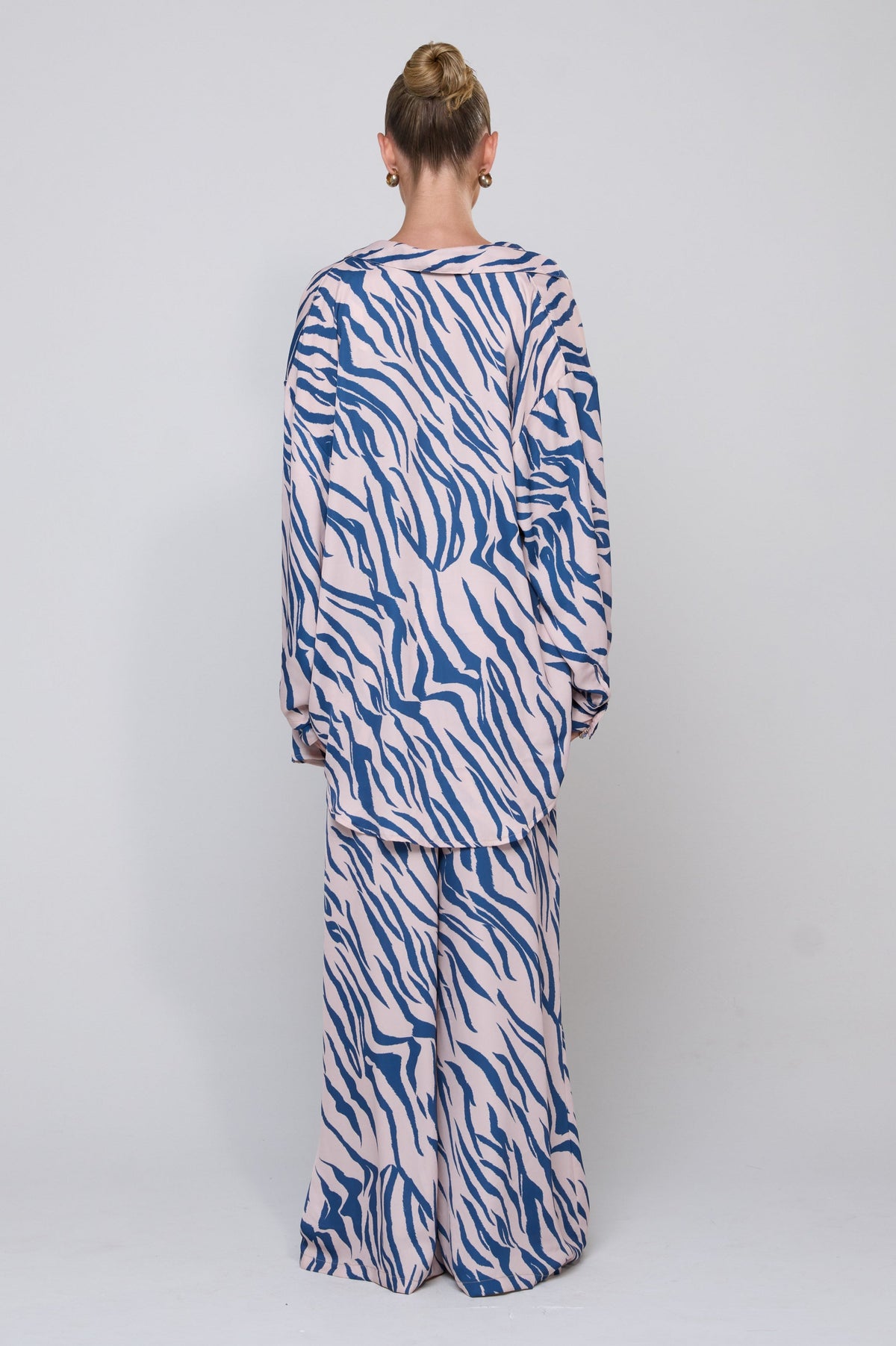 This is an image of Miley Set in Athens - RESA featuring a model wearing the dress