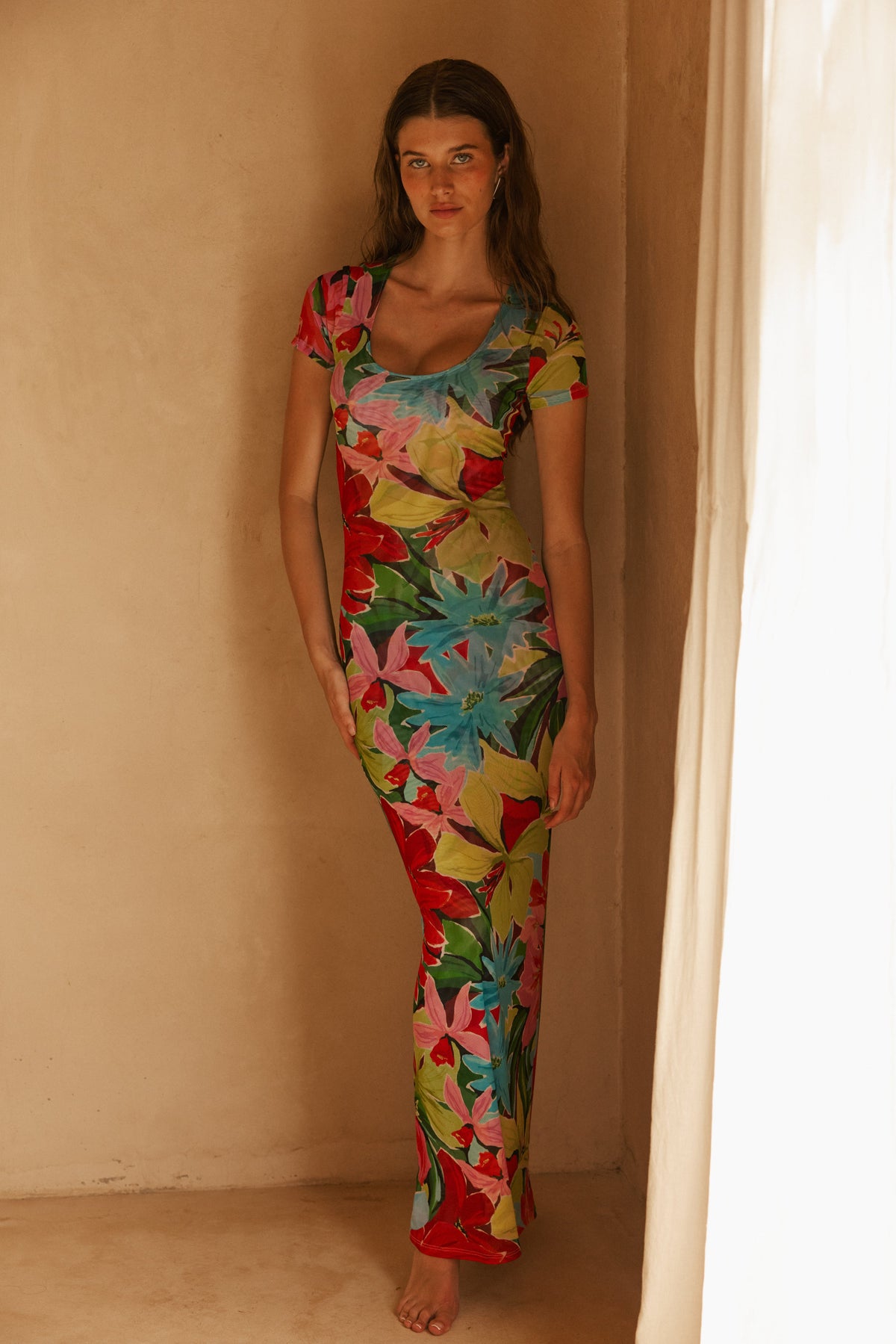 This is an image of Nari Dress in Tropicana - RESA featuring a model wearing the dress