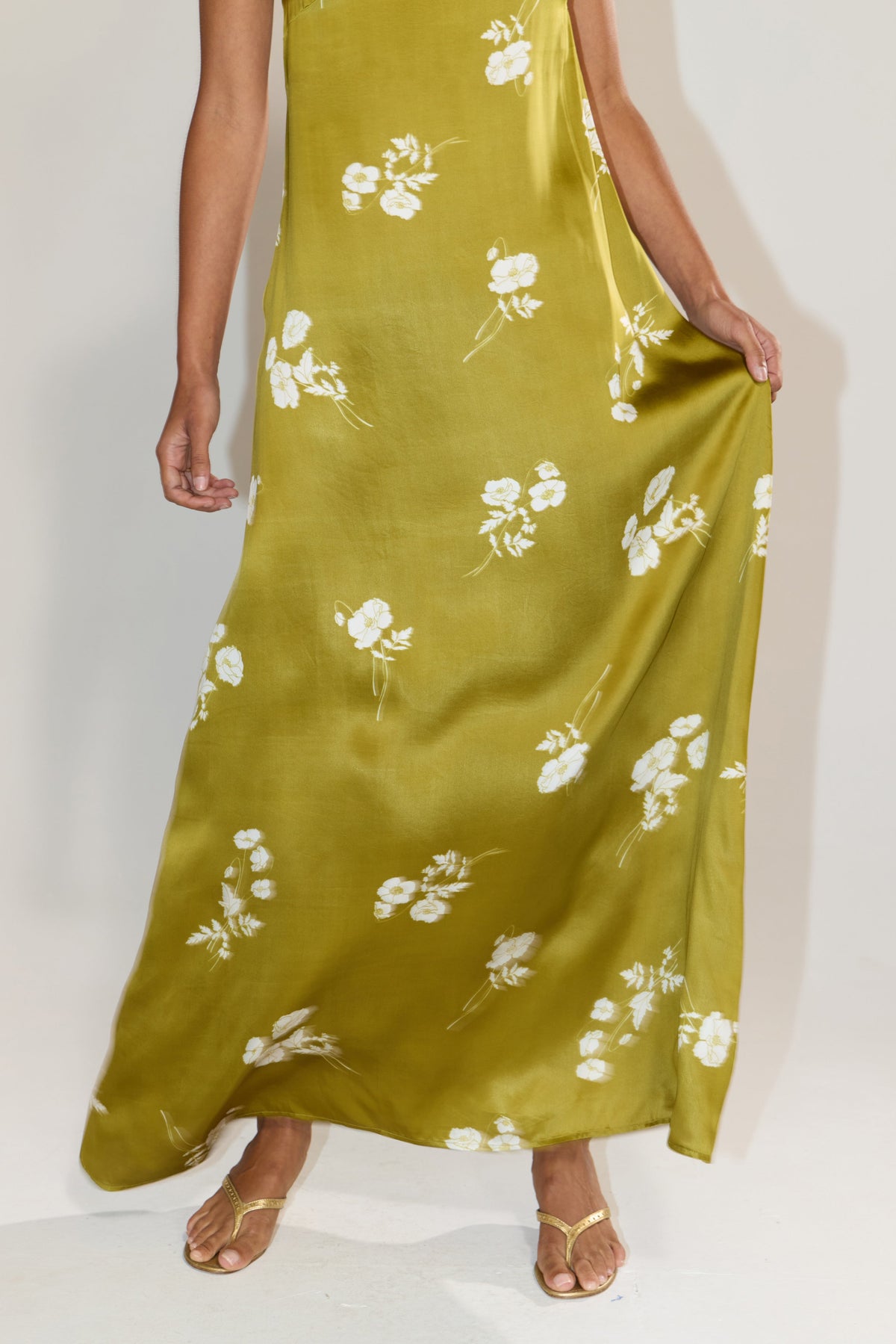 This is an image of Ophelia in Moss - RESA featuring a model wearing the dress