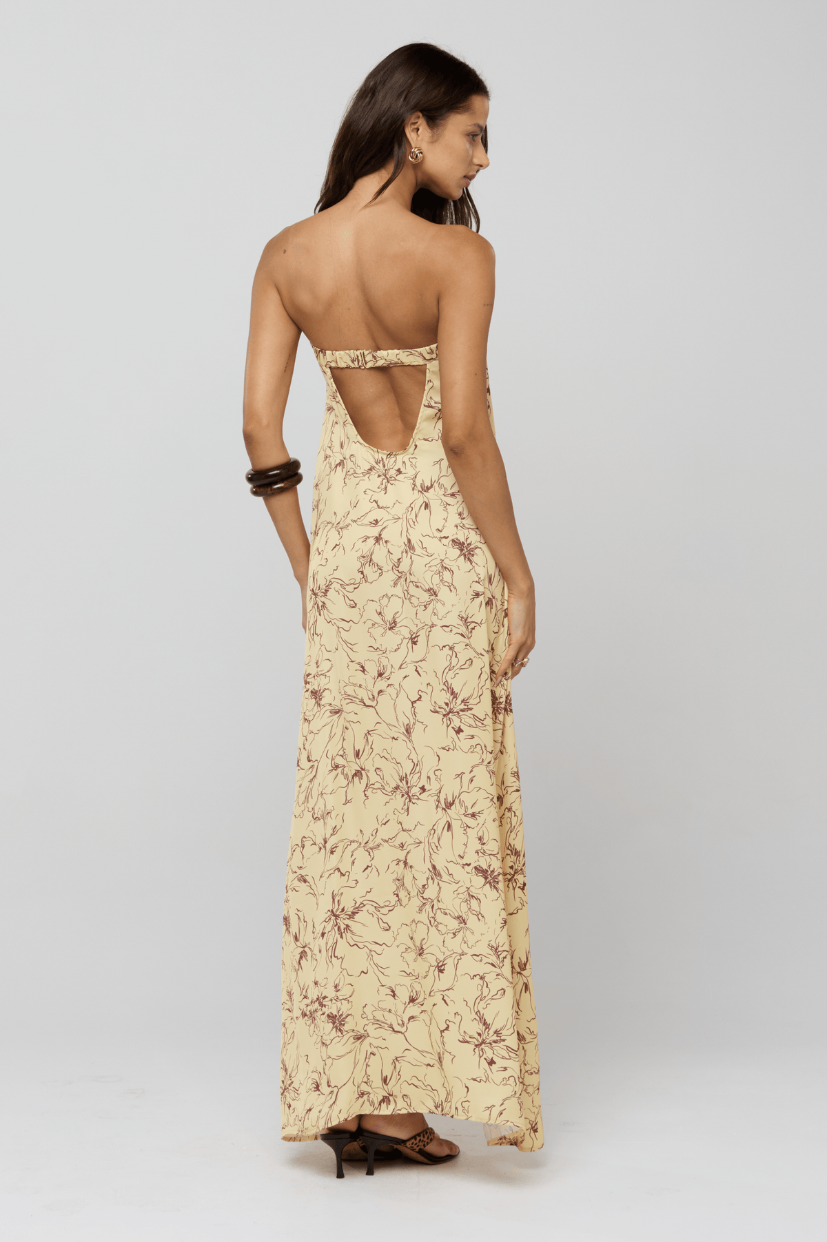This is an image of Ophelia Maxi Dress in Butterscotch - RESA featuring a model wearing the dress