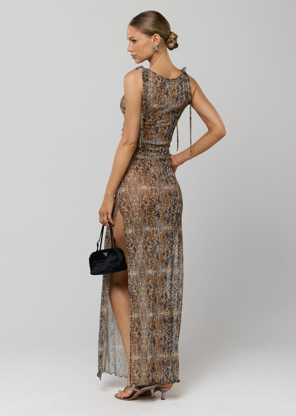 This is an image of Paige Dress in Serpent - RESA featuring a model wearing the dress