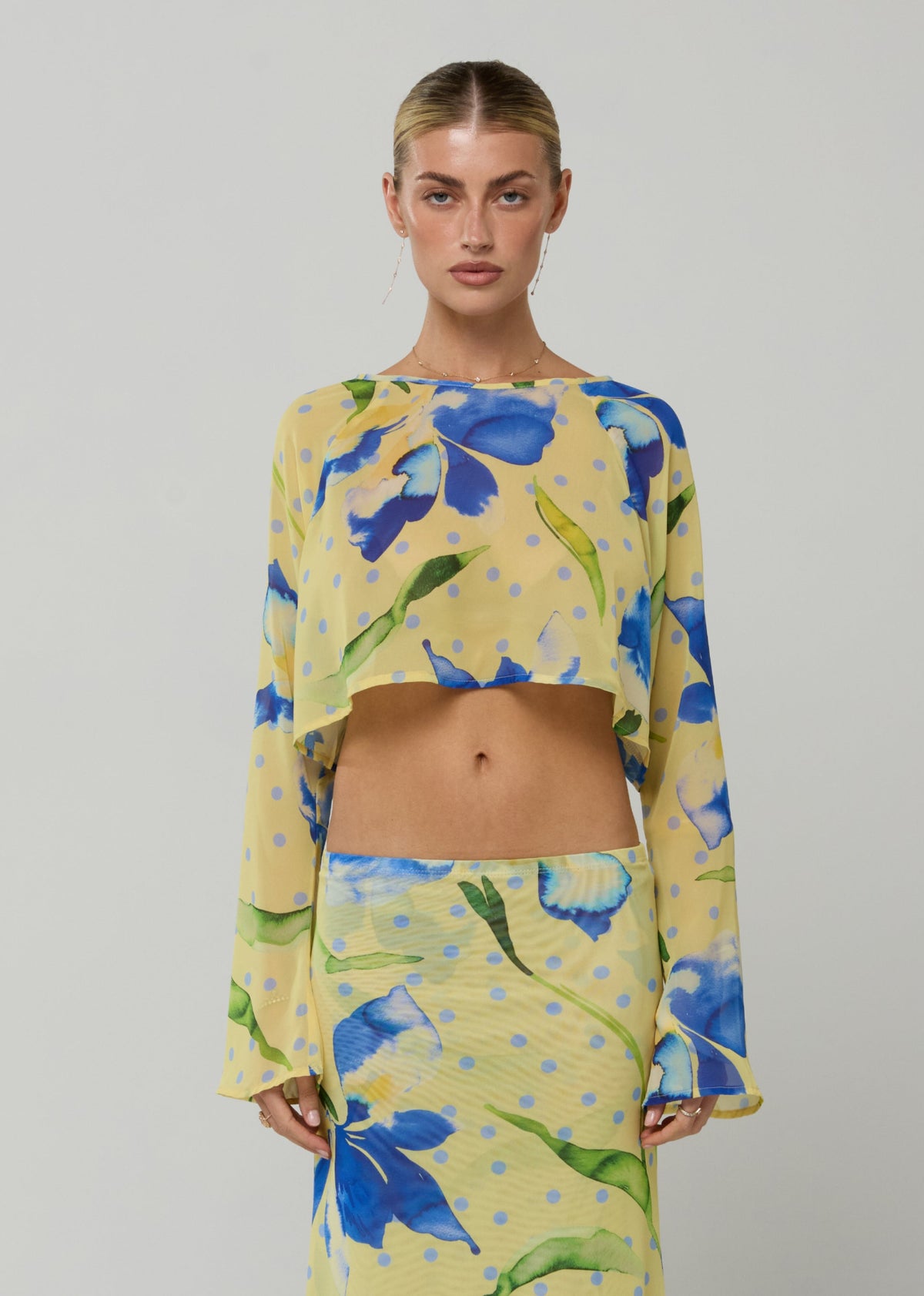 This is an image of Piper Crop Top in Solei - RESA featuring a model wearing the dress