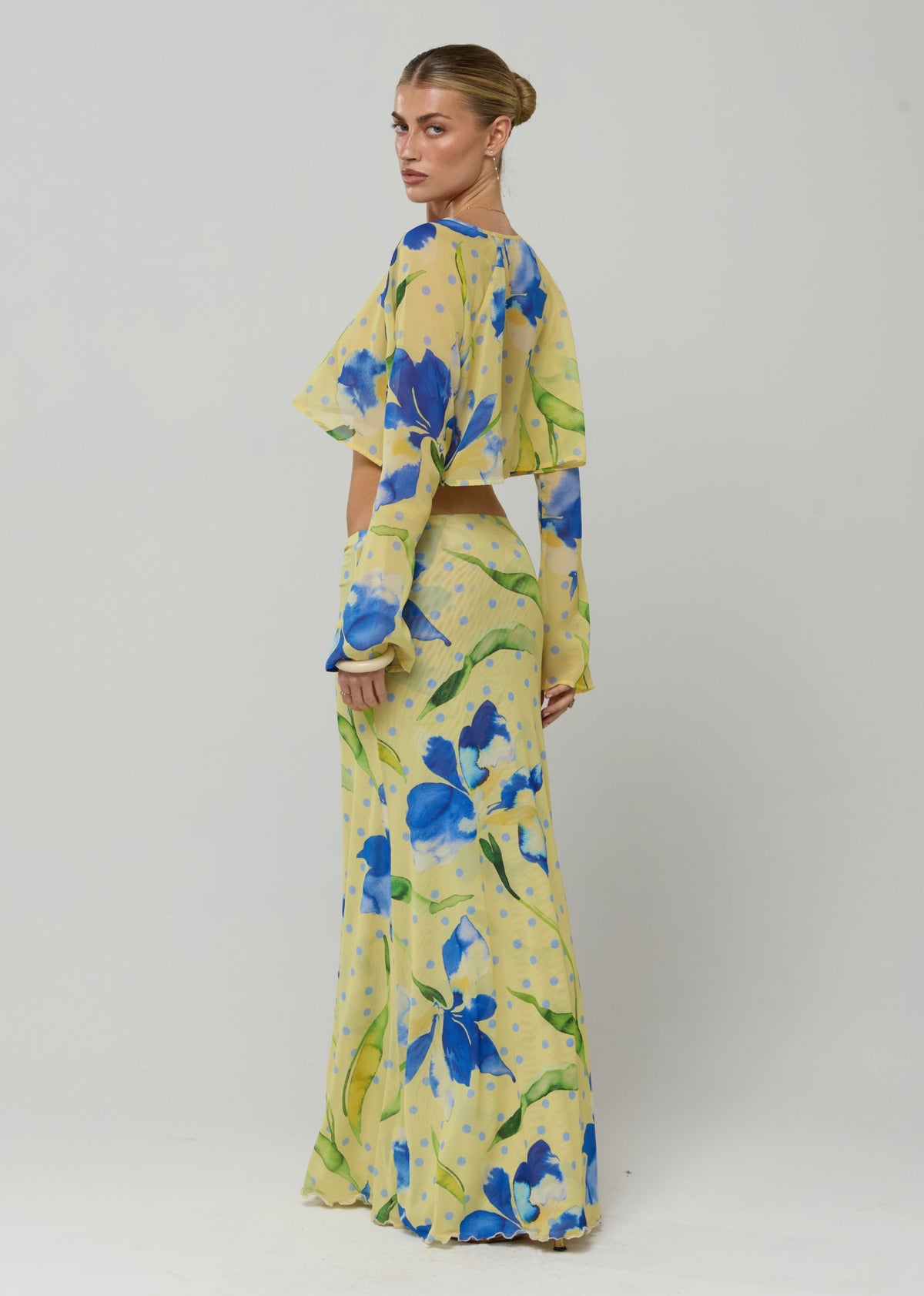 This is an image of Piper Crop Top in Solei - RESA featuring a model wearing the dress