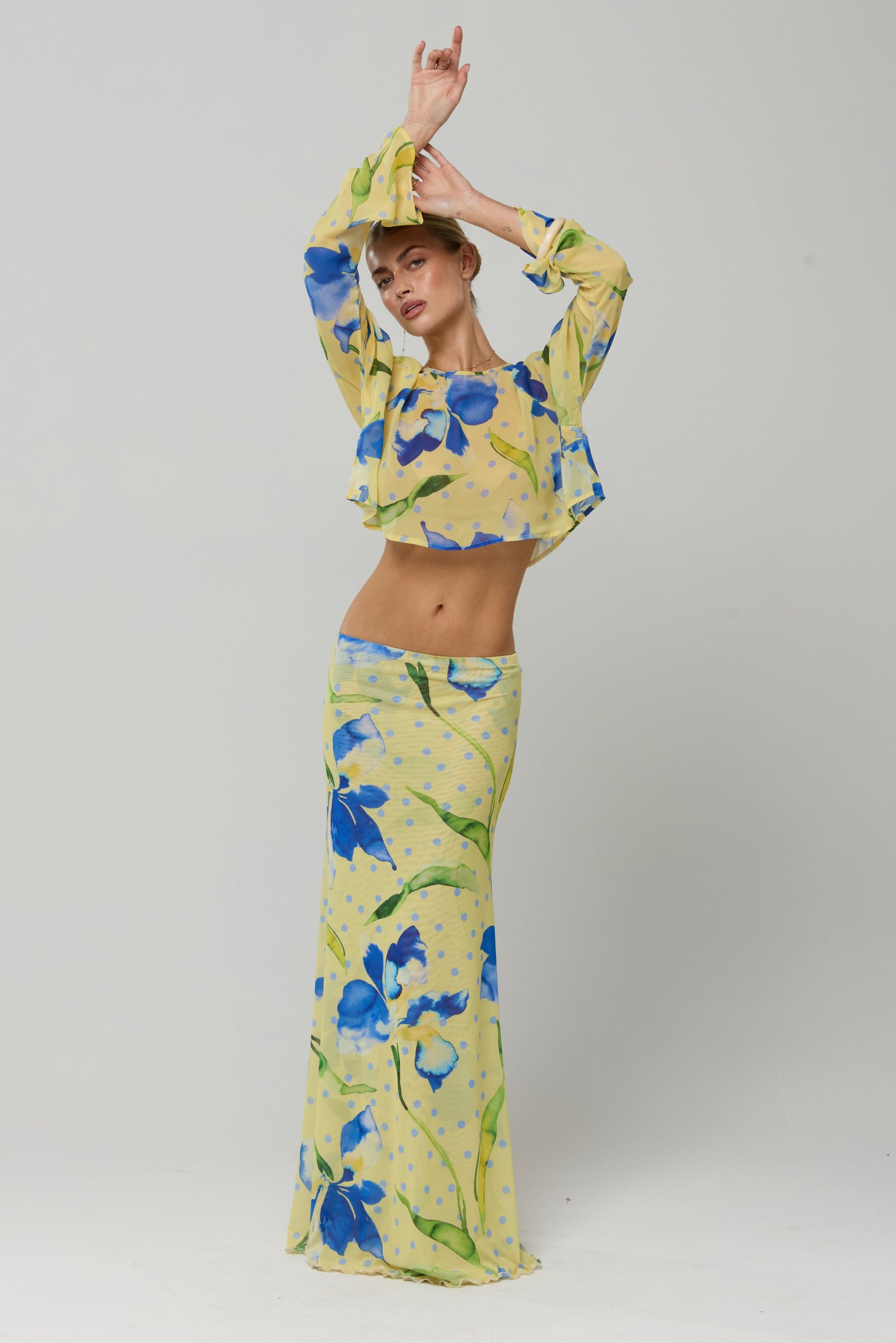 This is an image of Piper Crop Top in Solei - RESA featuring a model wearing the dress