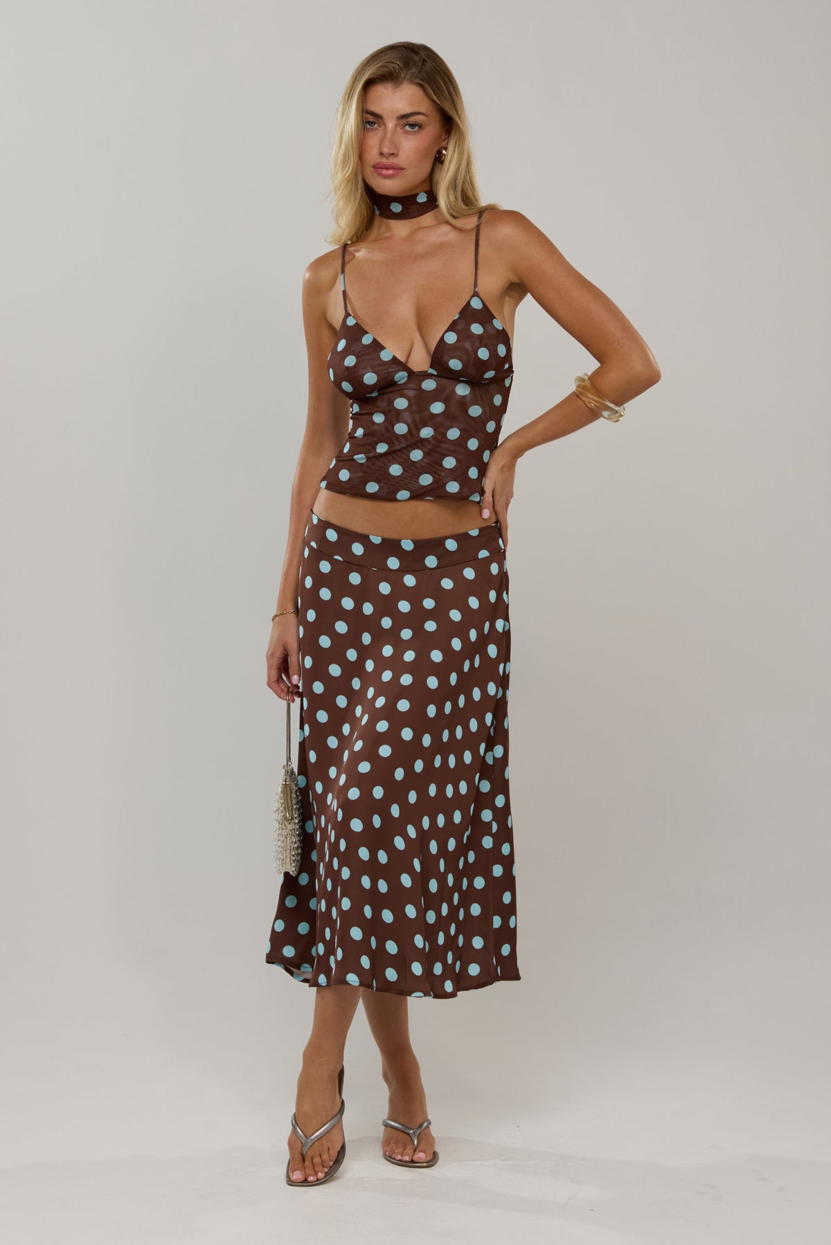 This is an image of Raven in Costa - RESA featuring a model wearing the dress