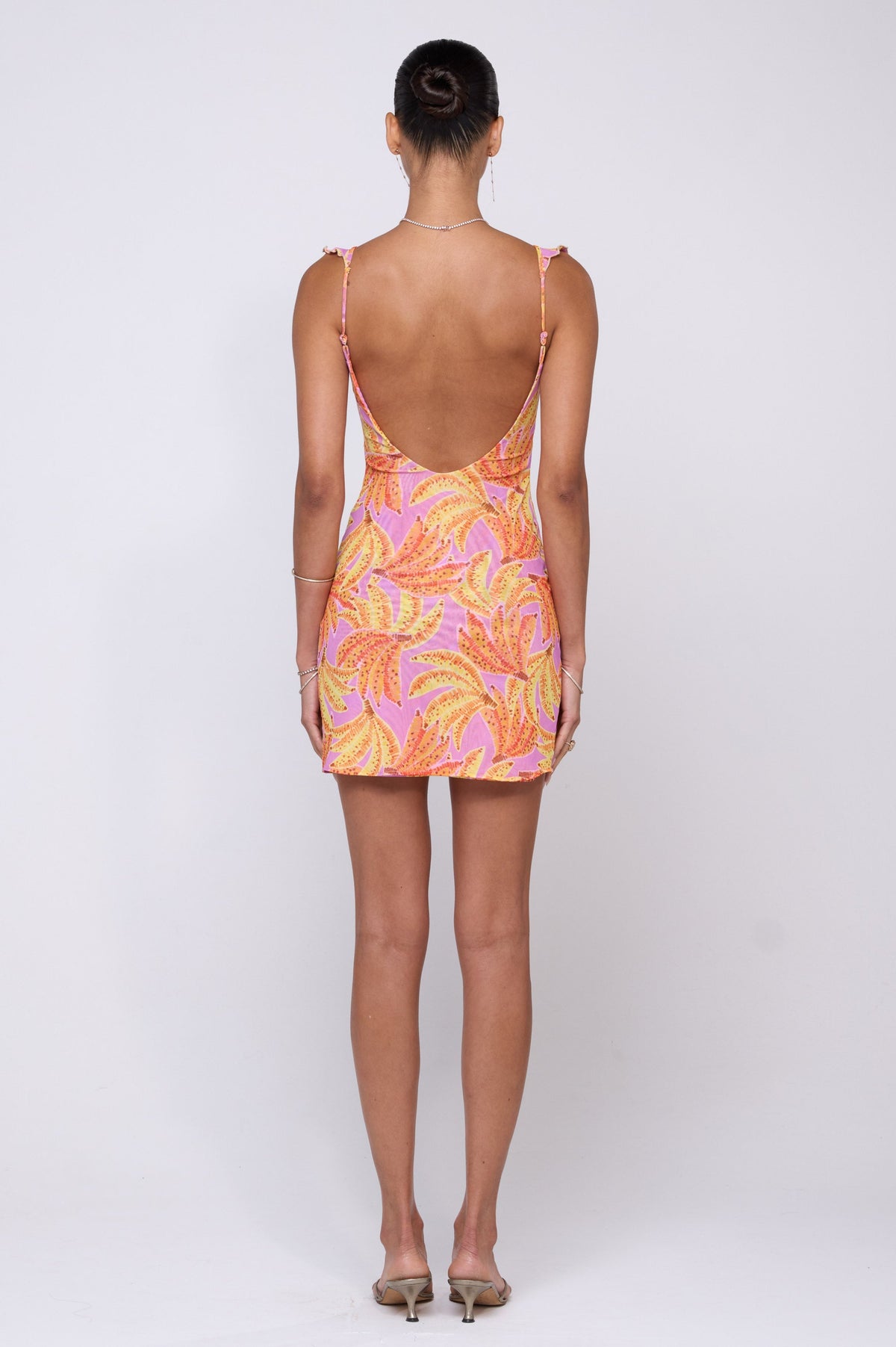 This is an image of Reese Mini in Chiquita - RESA featuring a model wearing the dress