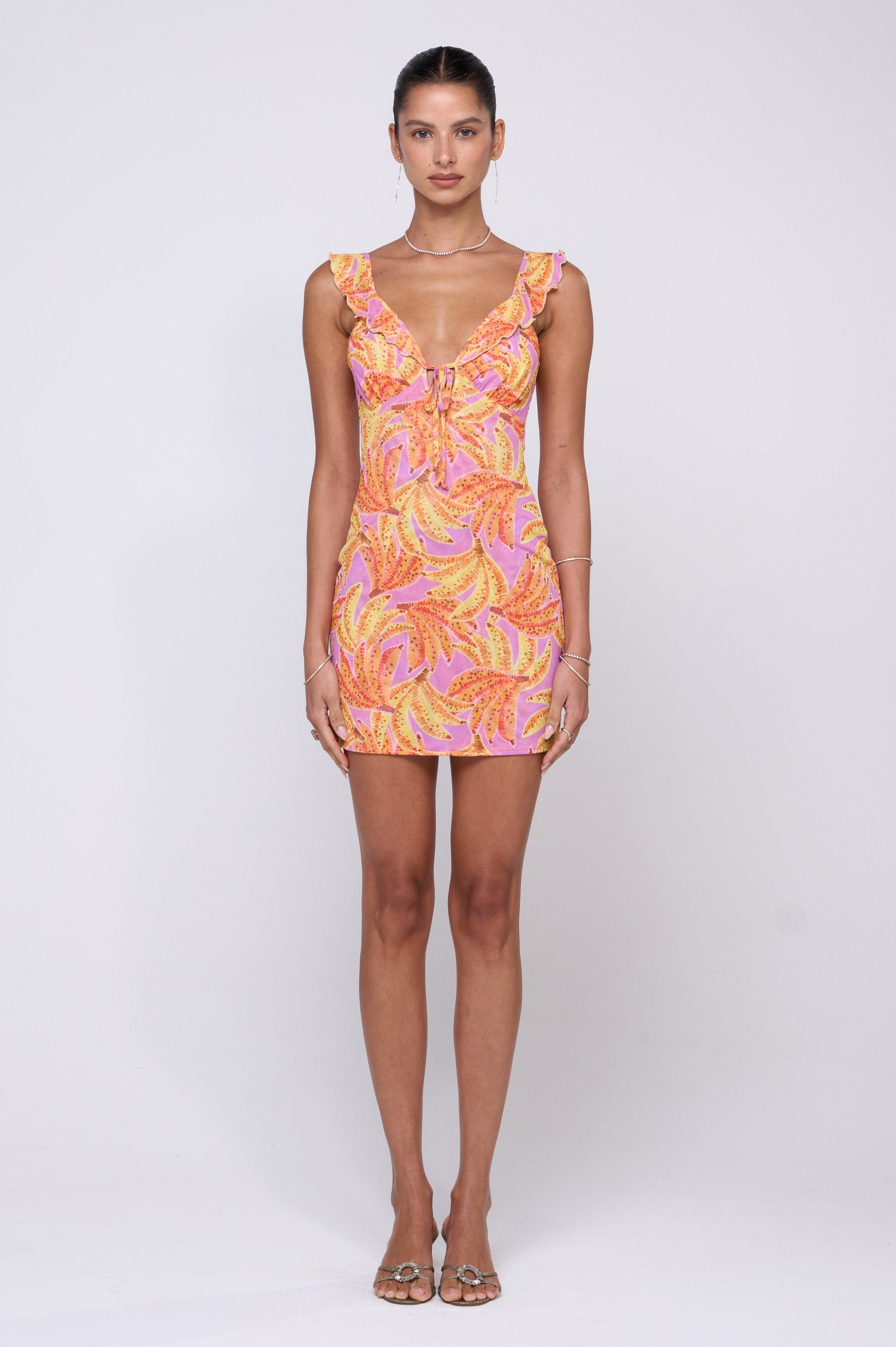 This is an image of Reese Mini in Chiquita - RESA featuring a model wearing the dress