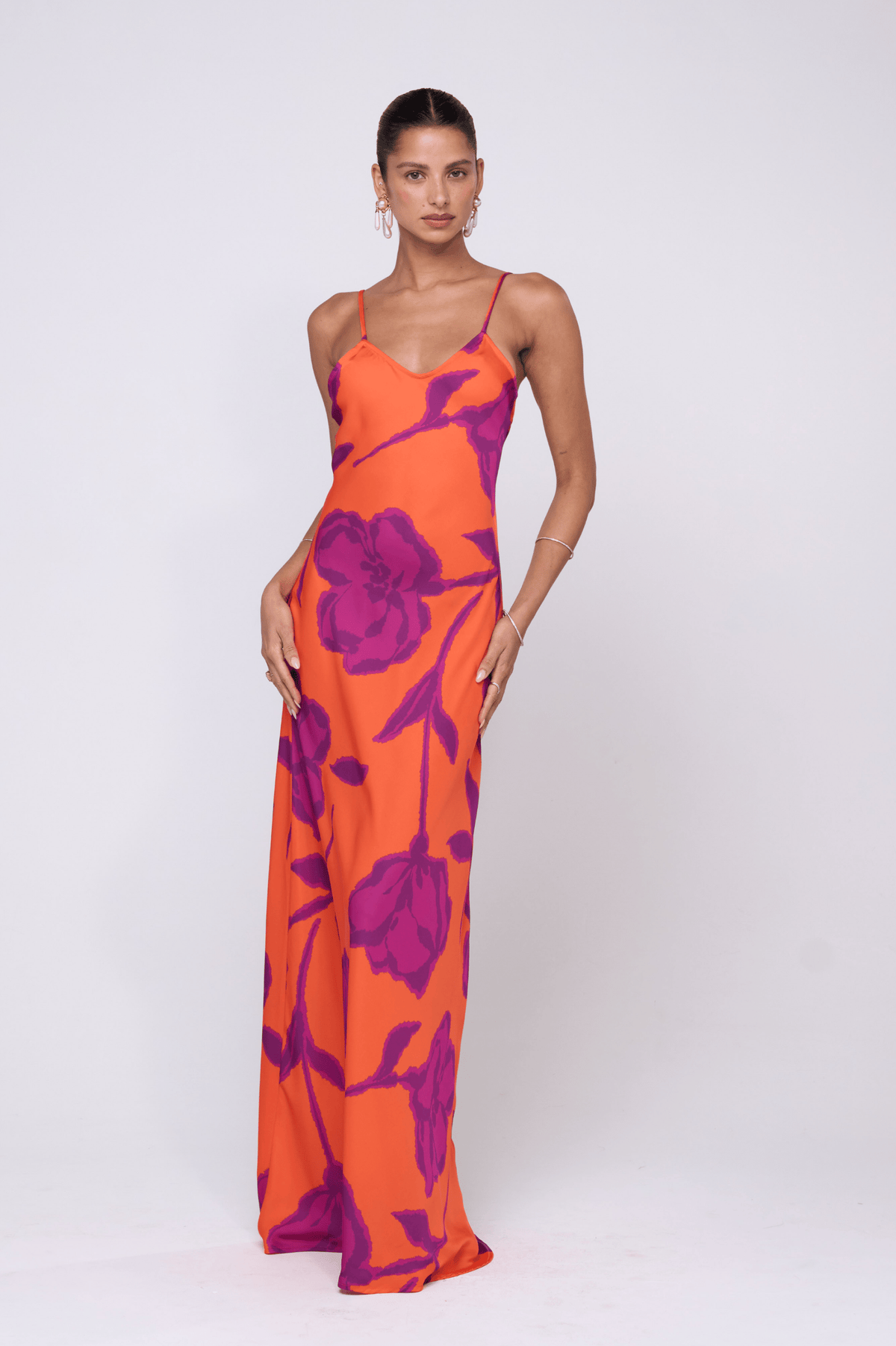 This is an image of Rose Dress in Mandarin - RESA featuring a model wearing the dress