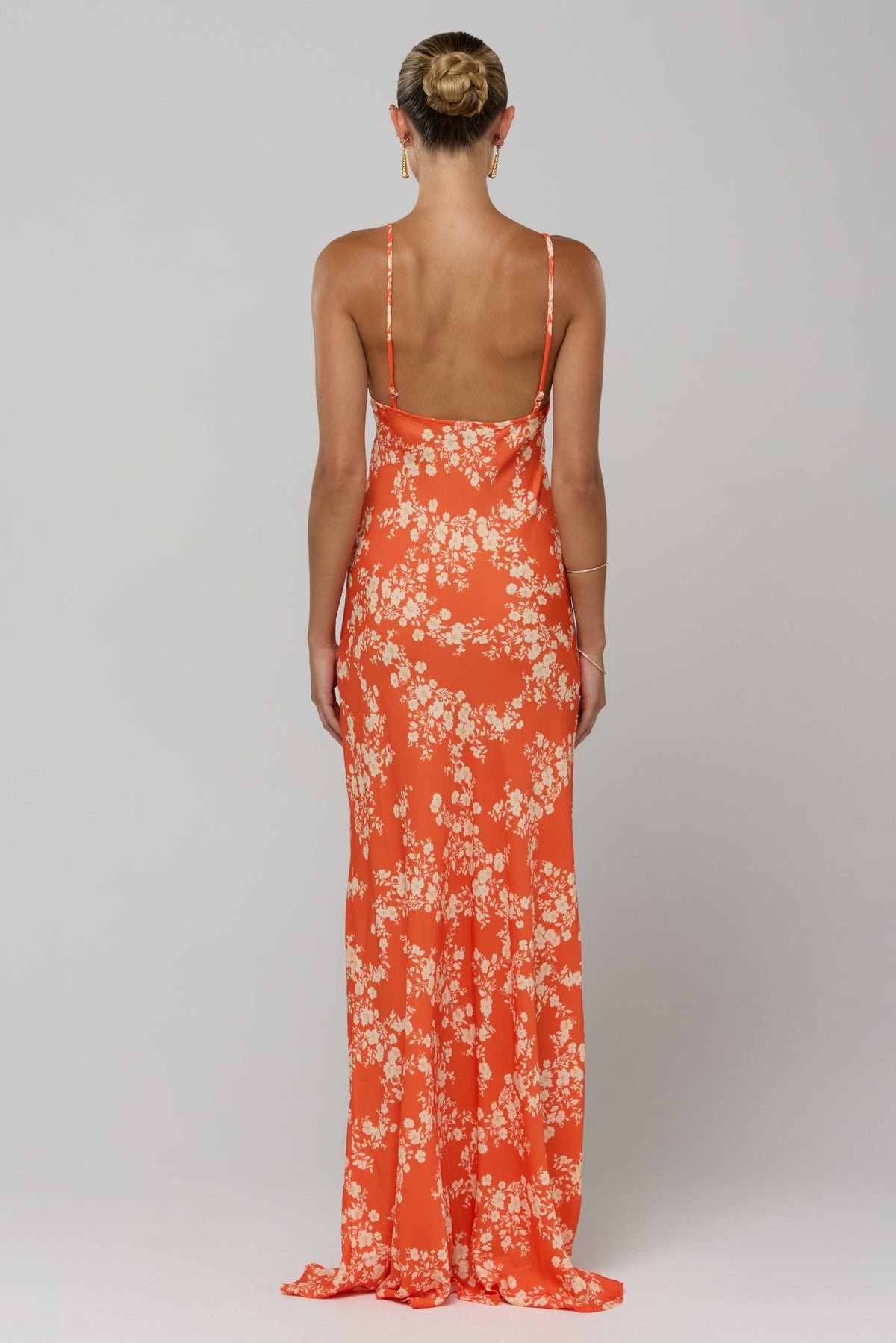 This is an image of Rose Maxi in Orange Blossom - RESA featuring a model wearing the dress