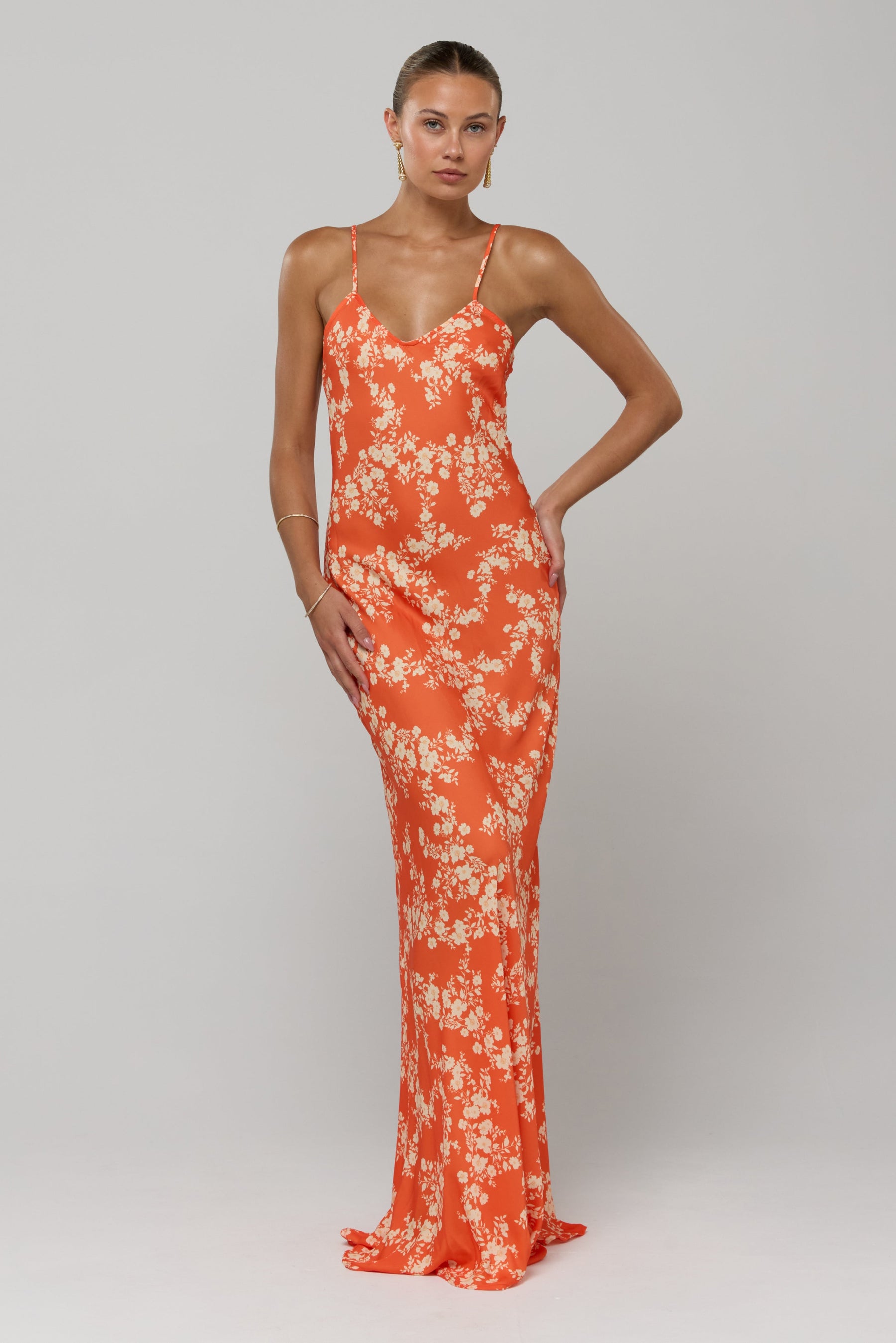 This is an image of Rose Maxi in Orange Blossom - RESA featuring a model wearing the dress