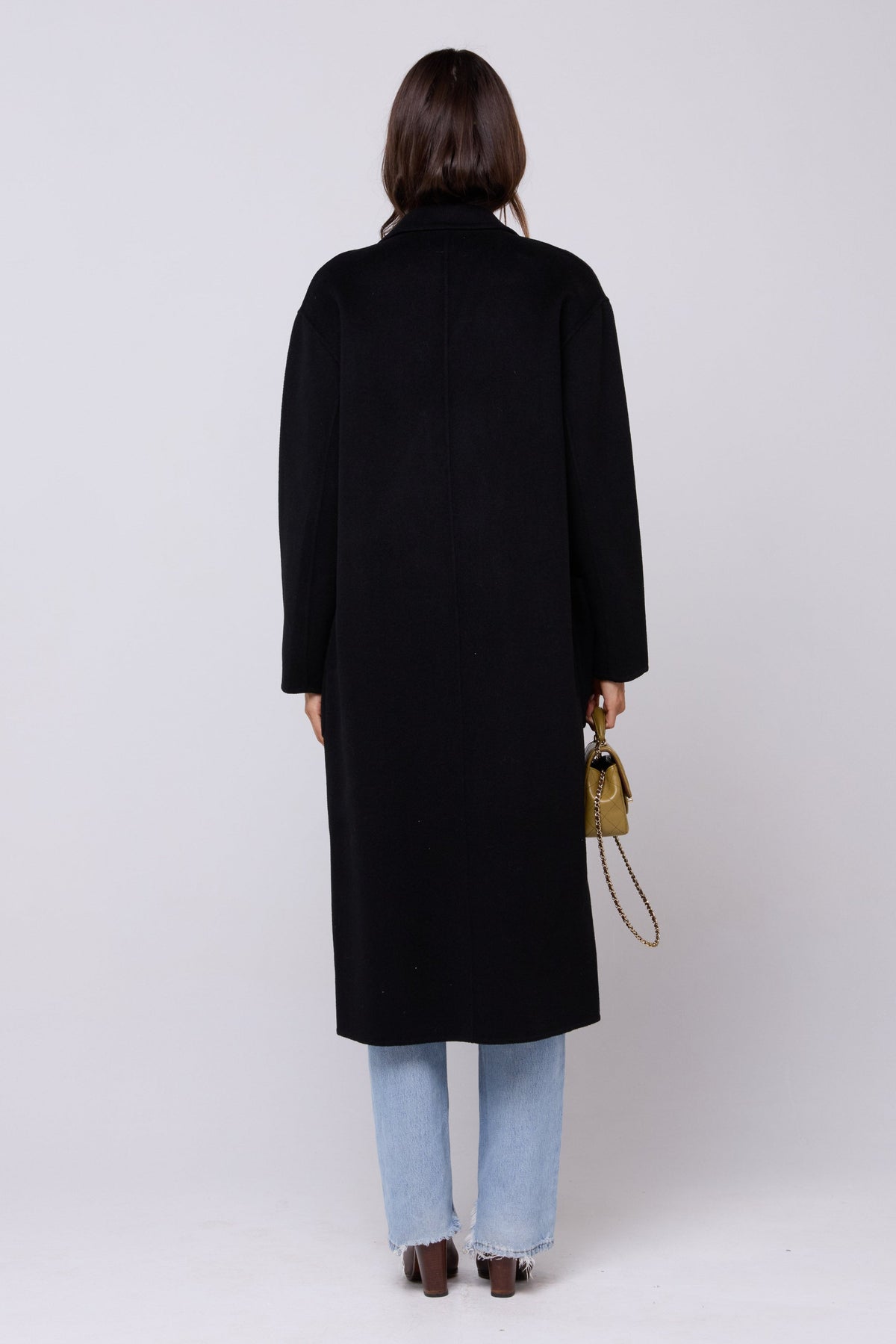 This is an image of Ryder Coat in Black - RESA featuring a model wearing the dress