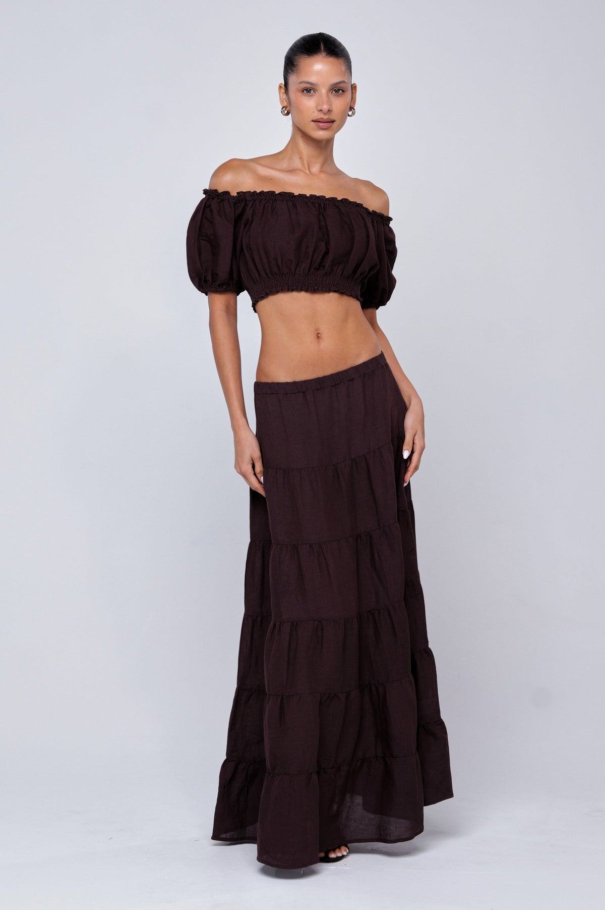 This is an image of Saige Top in Brown Linen - RESA featuring a model wearing the dress