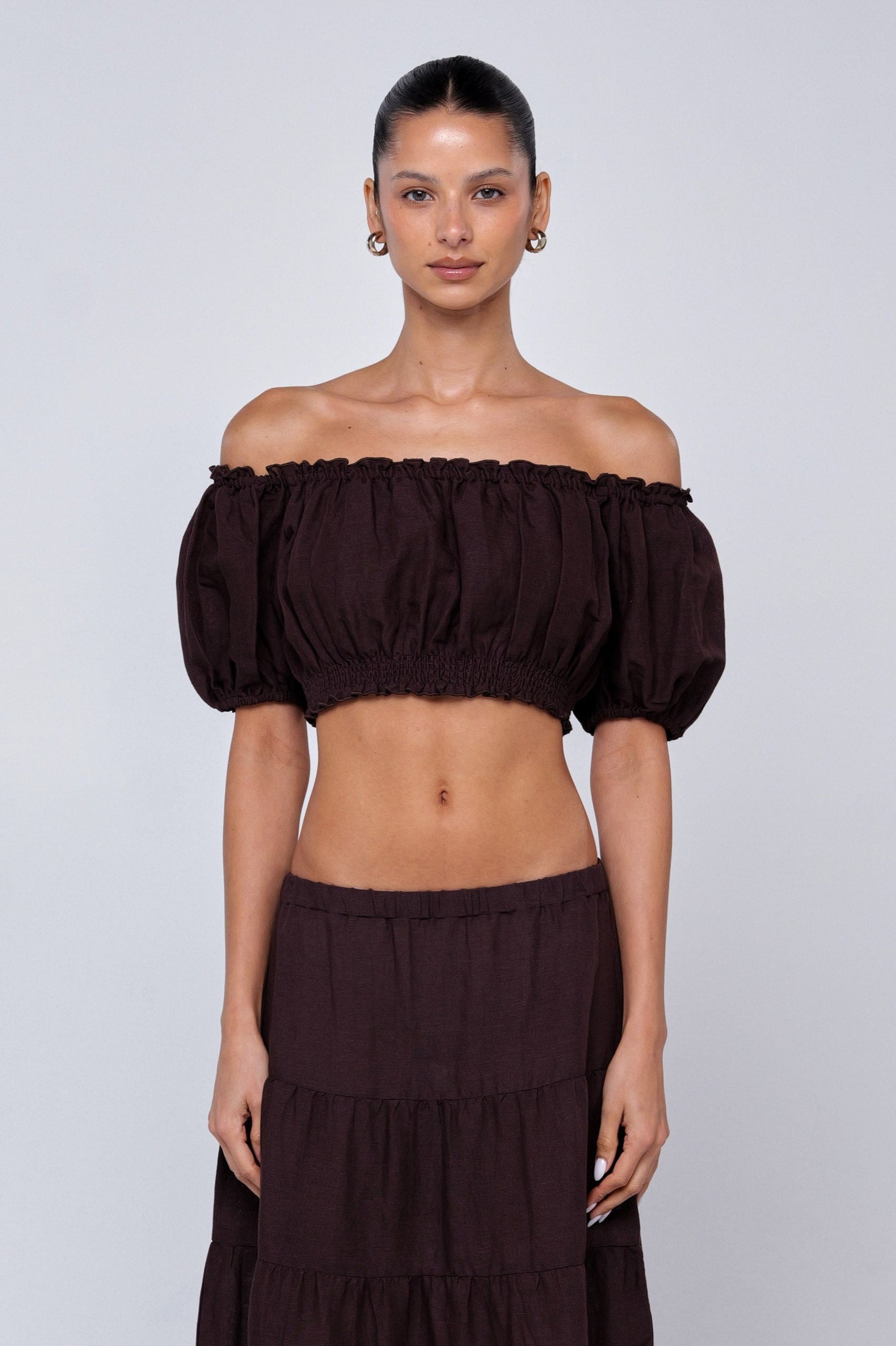 This is an image of Saige Top in Brown Linen - RESA featuring a model wearing the dress