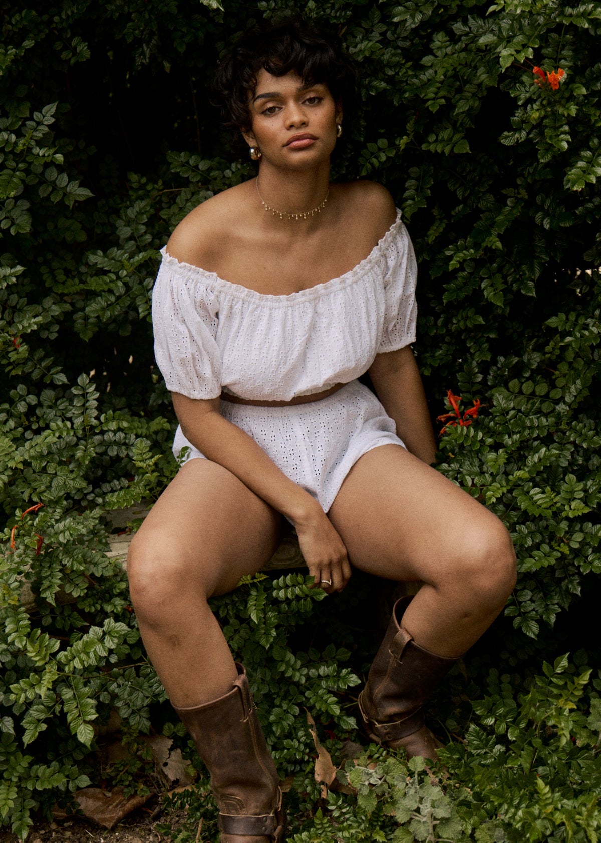 This is an image of Saige Top in White Eyelet - RESA featuring a model wearing the dress