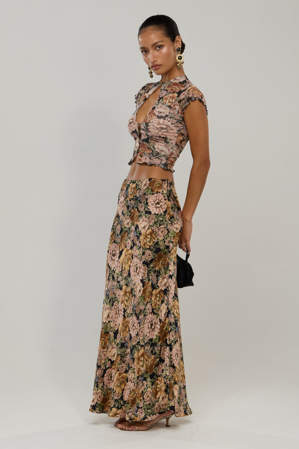 This is an image of Sarah in Antique - RESA featuring a model wearing the dress