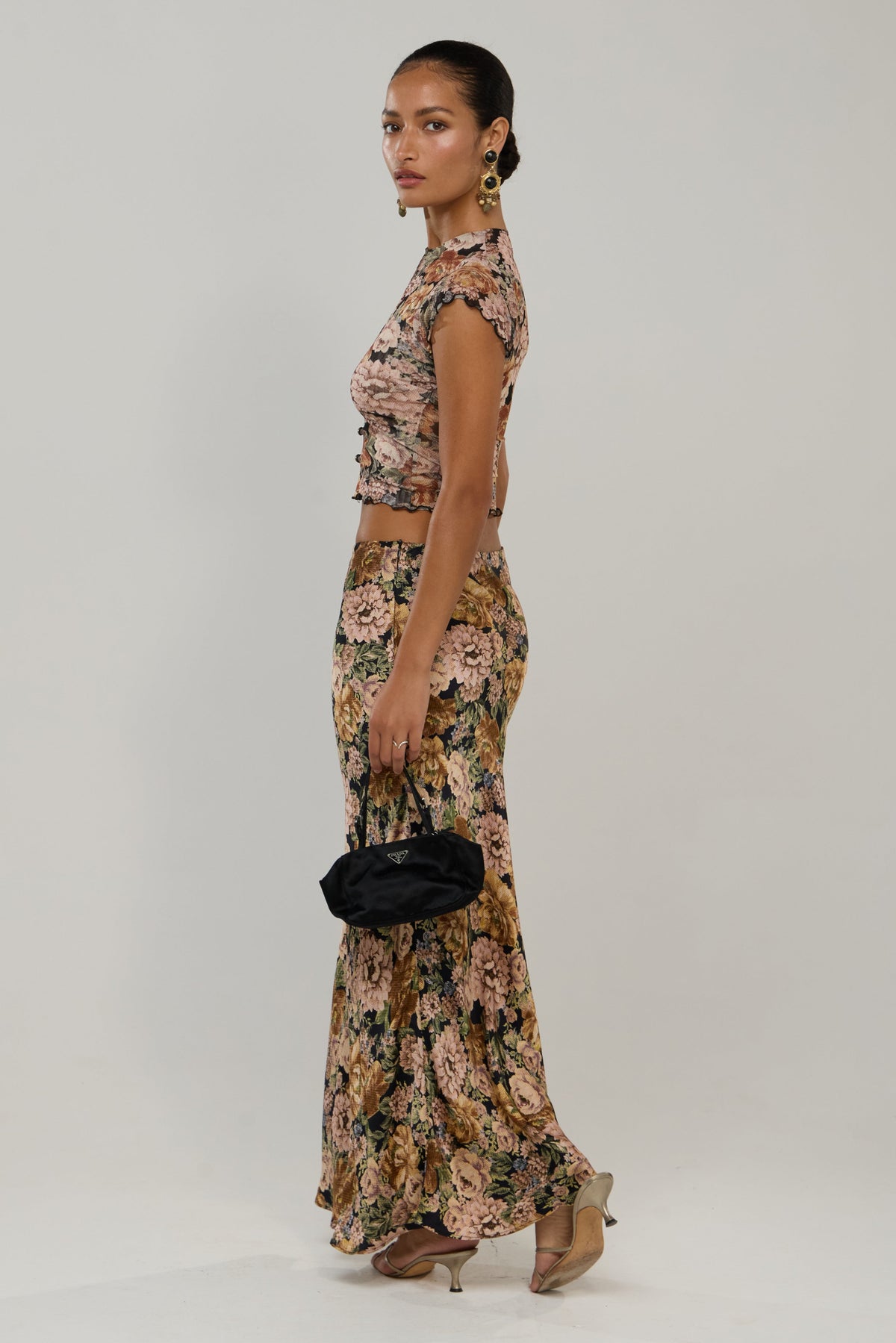 This is an image of Sarah in Antique - RESA featuring a model wearing the dress