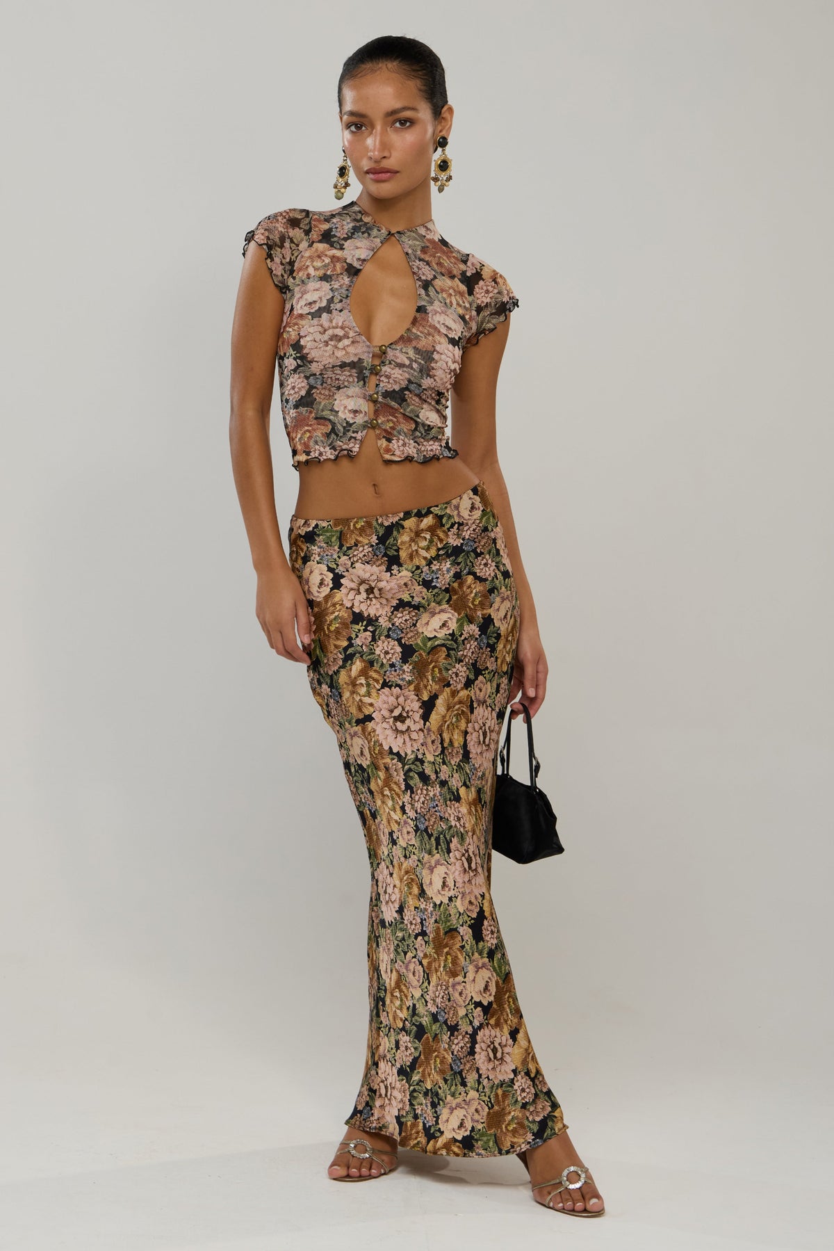 This is an image of Sarah in Antique - RESA featuring a model wearing the dress