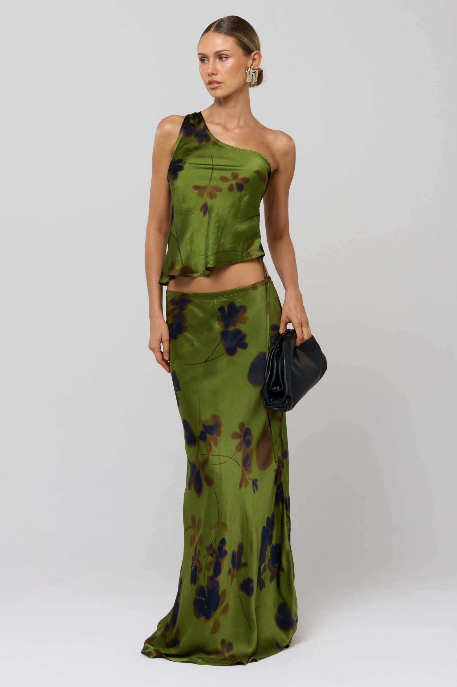 This is an image of Sarah Skirt in Evergreen - RESA featuring a model wearing the dress