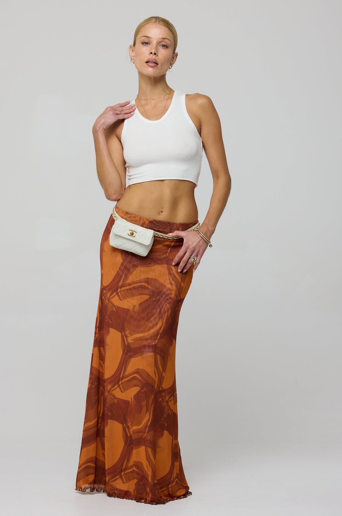 This is an image of Sarah Skirt in Flame - RESA featuring a model wearing the dress