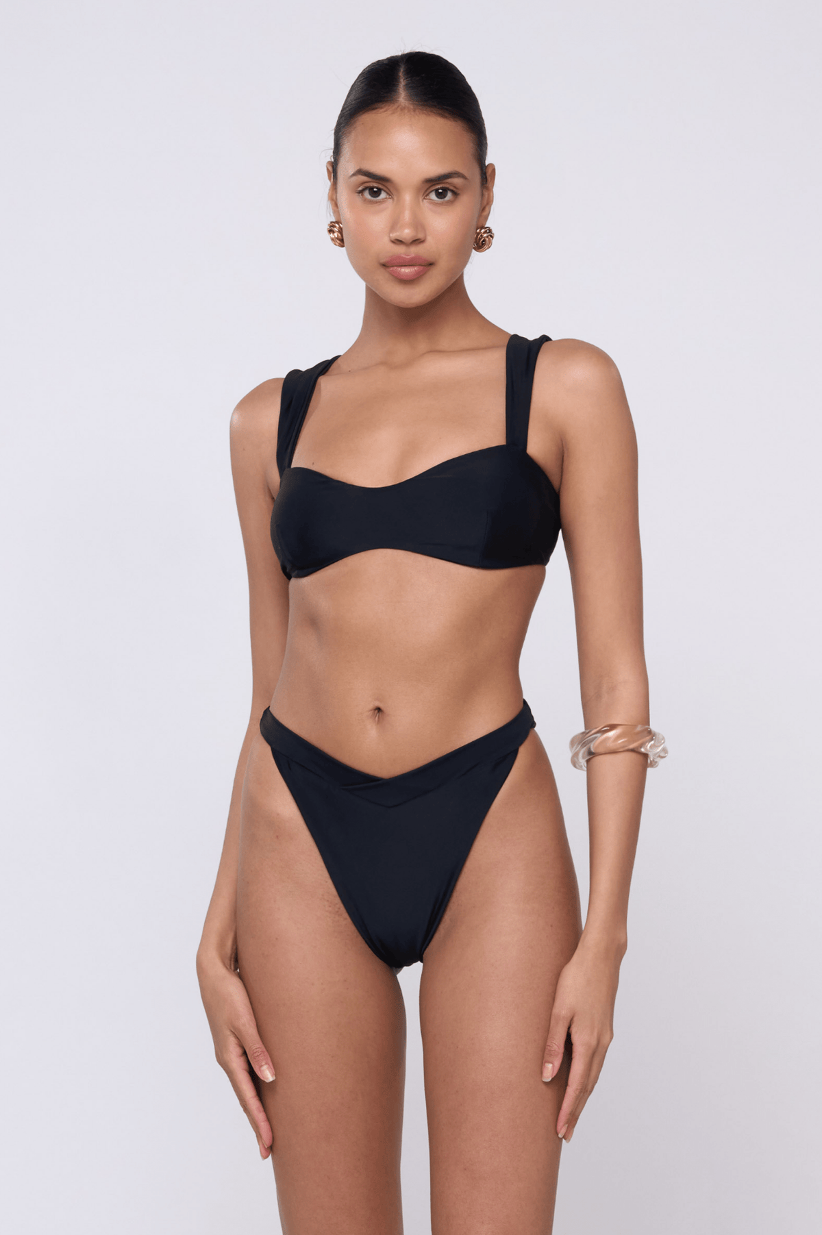 This is an image of Selma Bikini Top in Black - RESA featuring a model wearing the dress