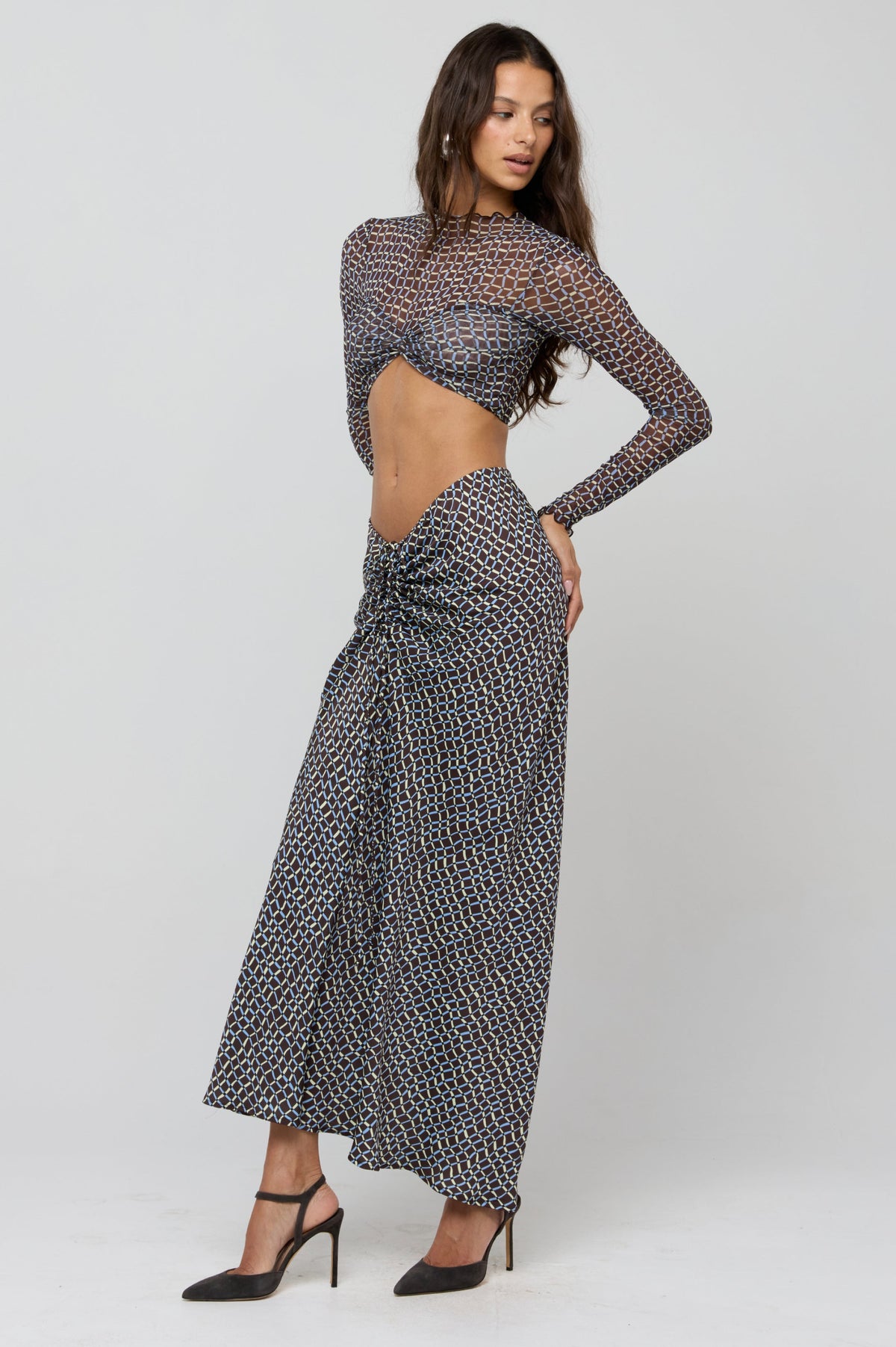 This is an image of Shelby Top in Tide - RESA featuring a model wearing the dress