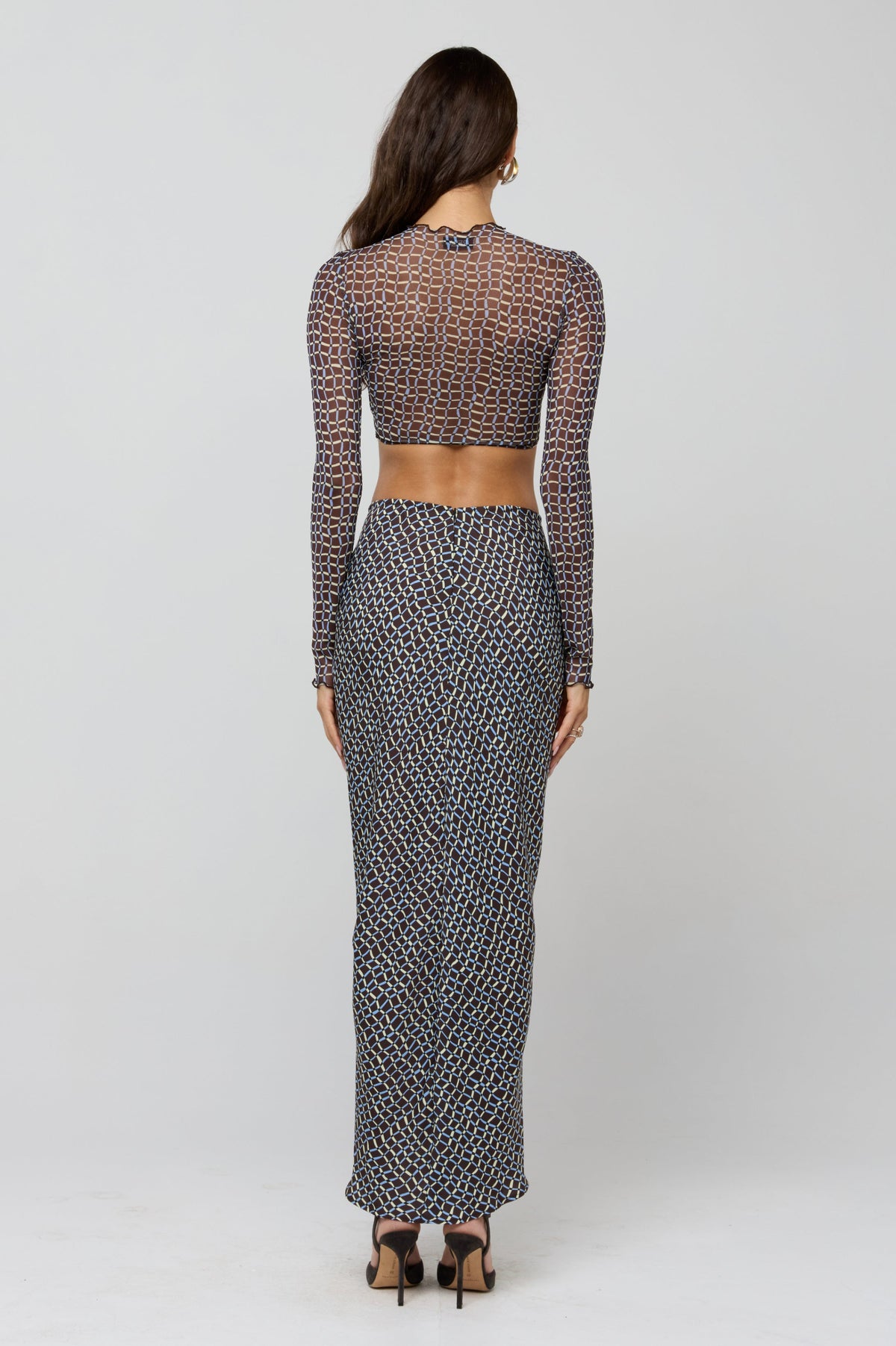 This is an image of Shelby Top in Tide - RESA featuring a model wearing the dress