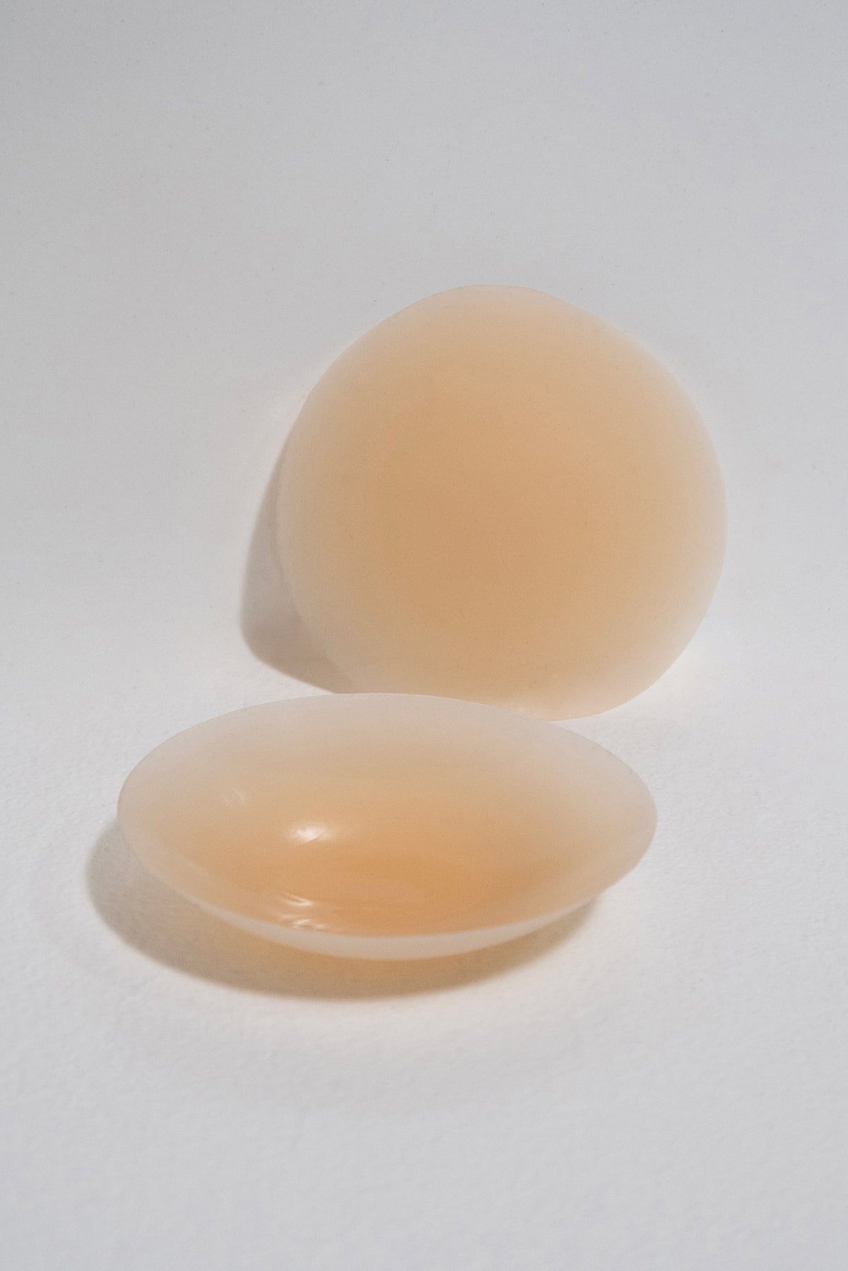 This is an image of Silicone Pasties in Medium Nude - RESA featuring a model wearing the dress