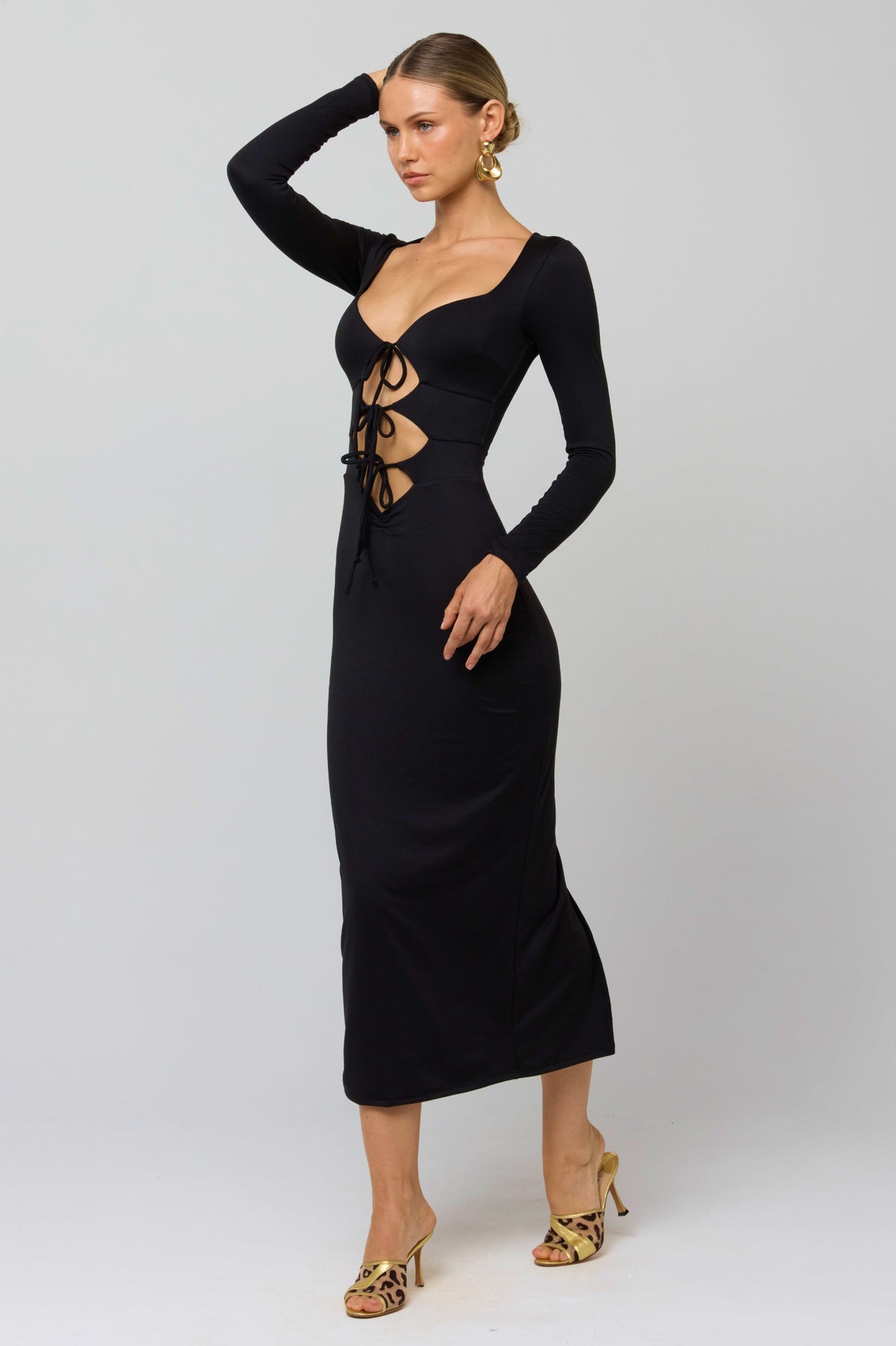 This is an image of Simone Dress in Black - RESA featuring a model wearing the dress