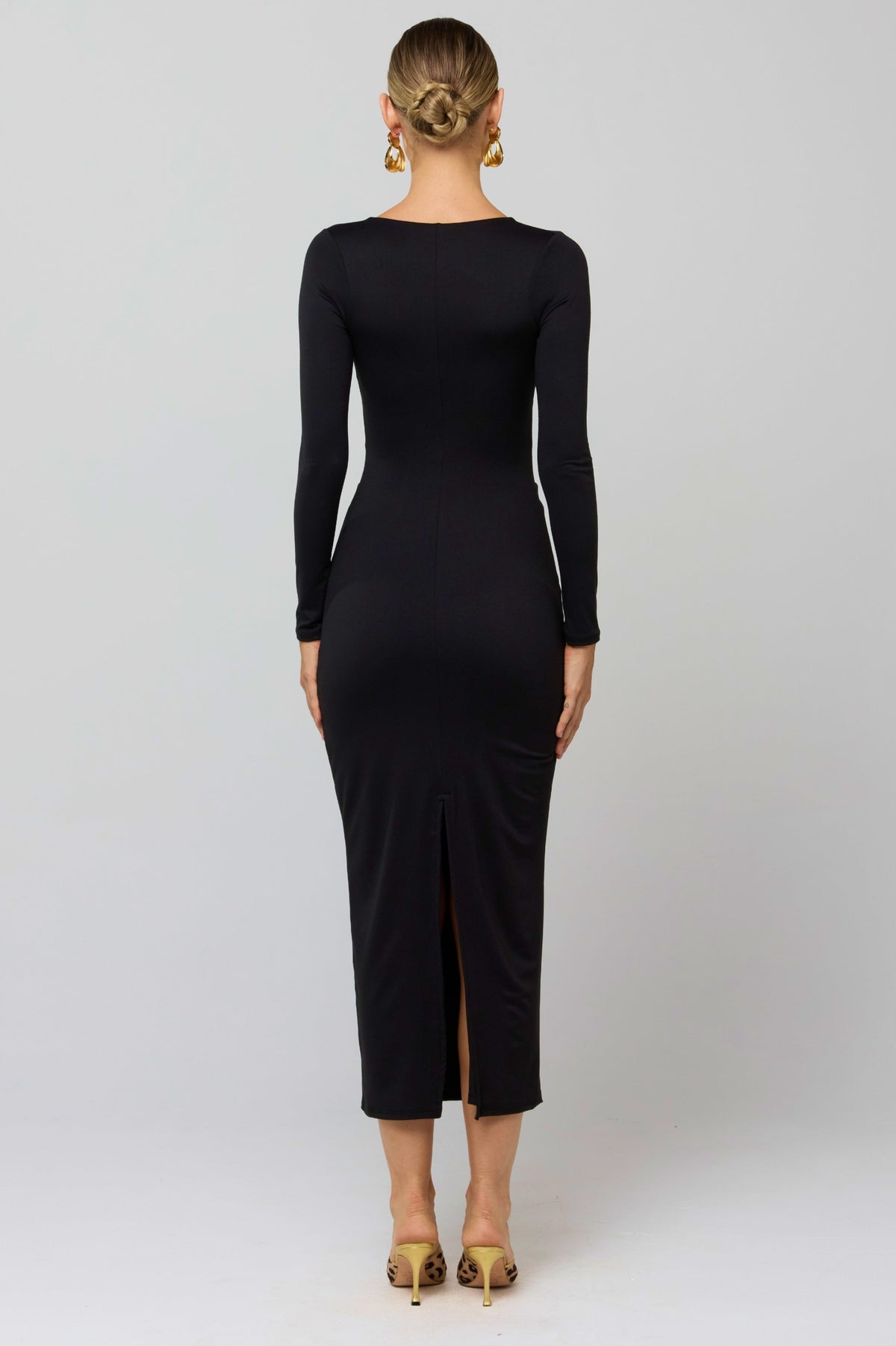 This is an image of Simone Dress in Black - RESA featuring a model wearing the dress