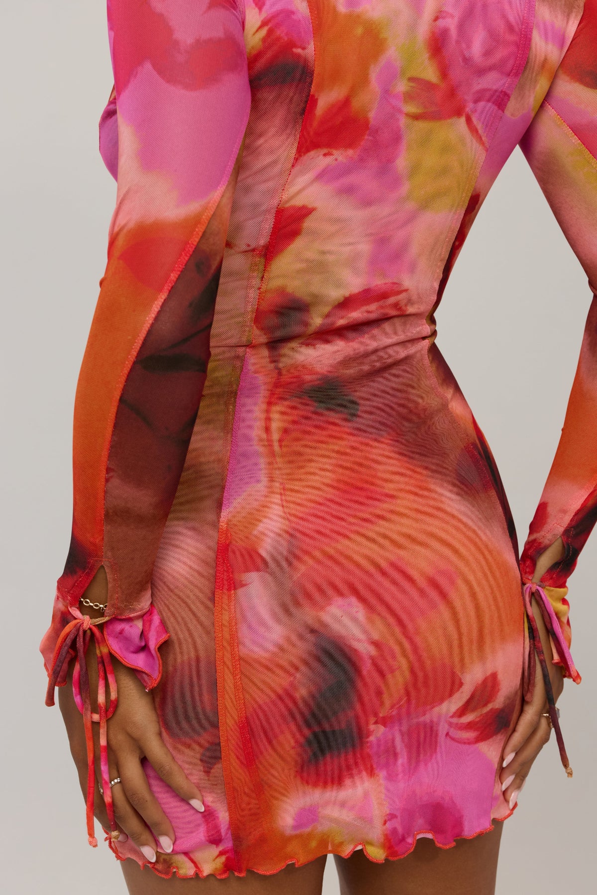 This is an image of Sloane Mini in Lilikoi - RESA featuring a model wearing the dress
