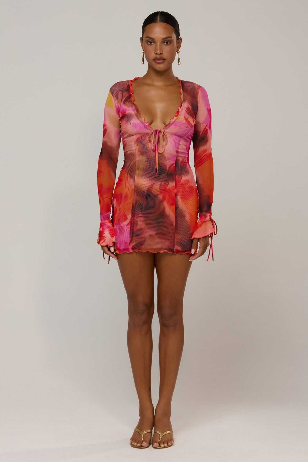 This is an image of Sloane Mini in Lilikoi - RESA featuring a model wearing the dress