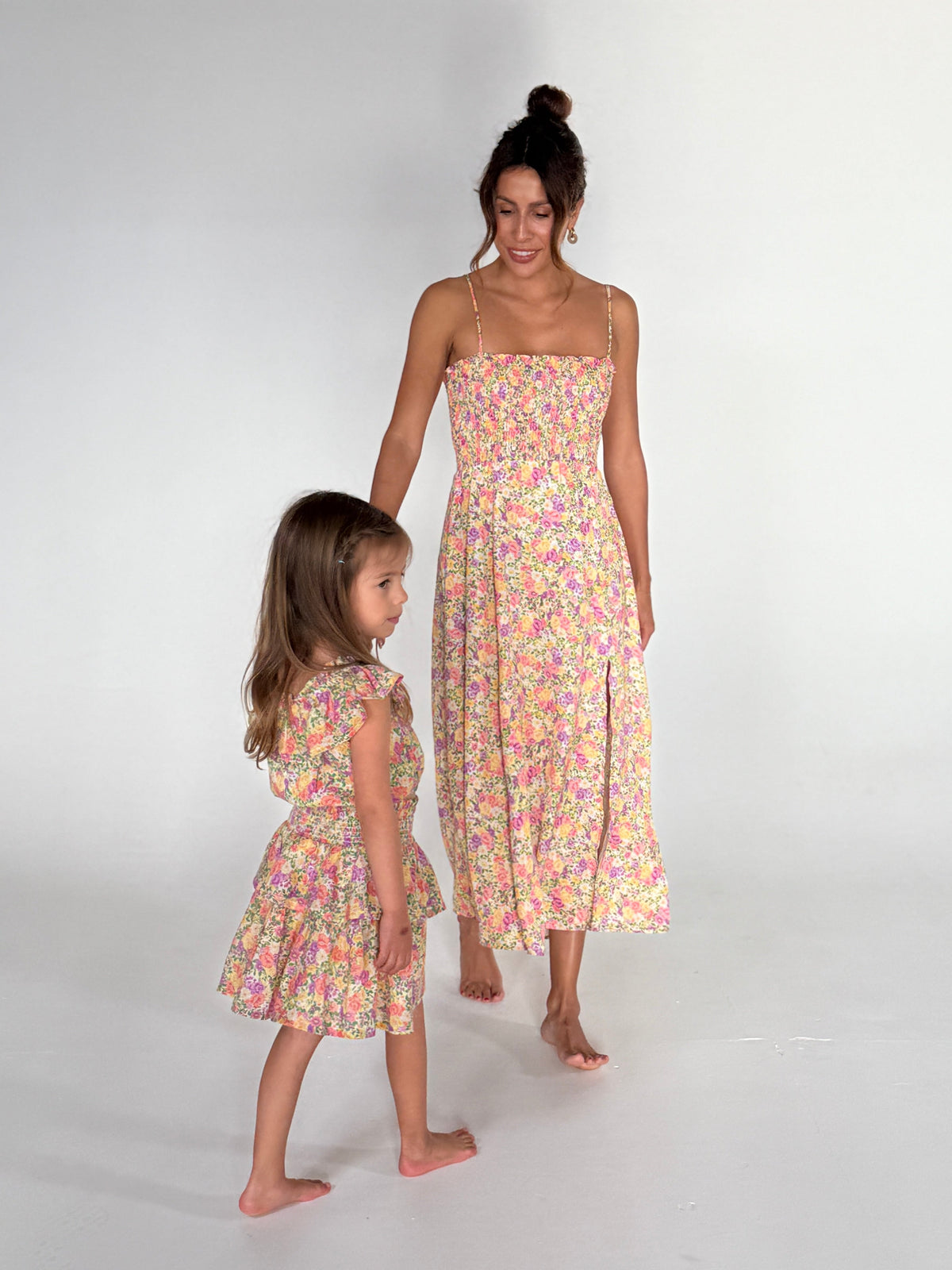 This is an image of Stella Kids Set in April - RESA featuring a model wearing the dress