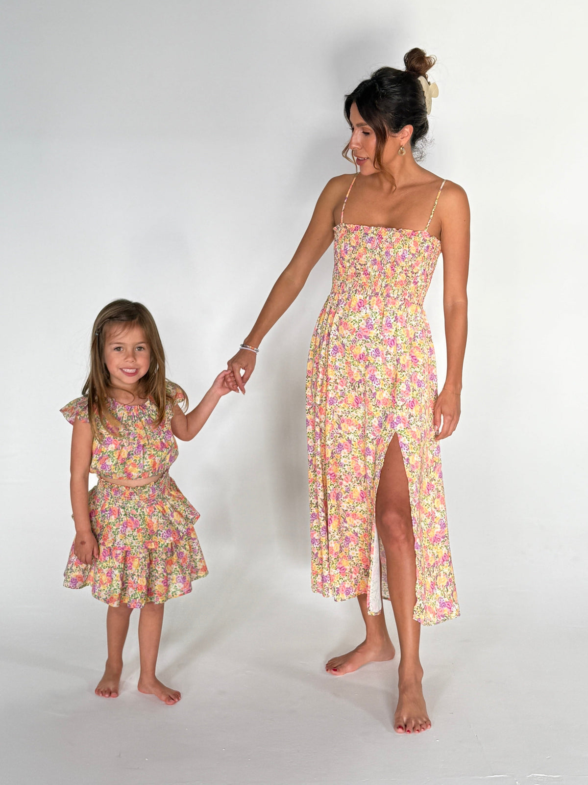 This is an image of Stella Kids Set in April - RESA featuring a model wearing the dress