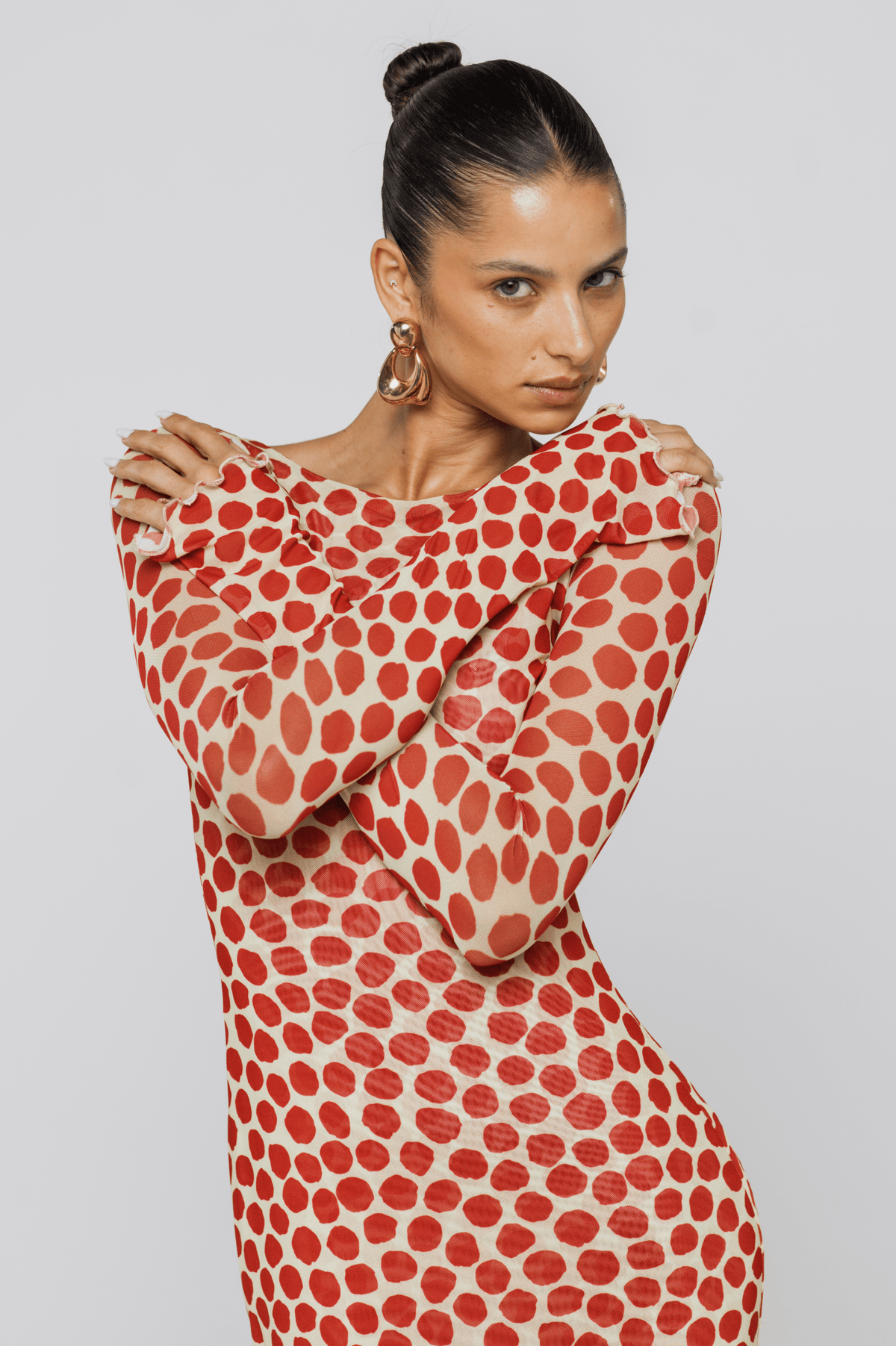 This is an image of Sylvia Dress in Campari - RESA featuring a model wearing the dress