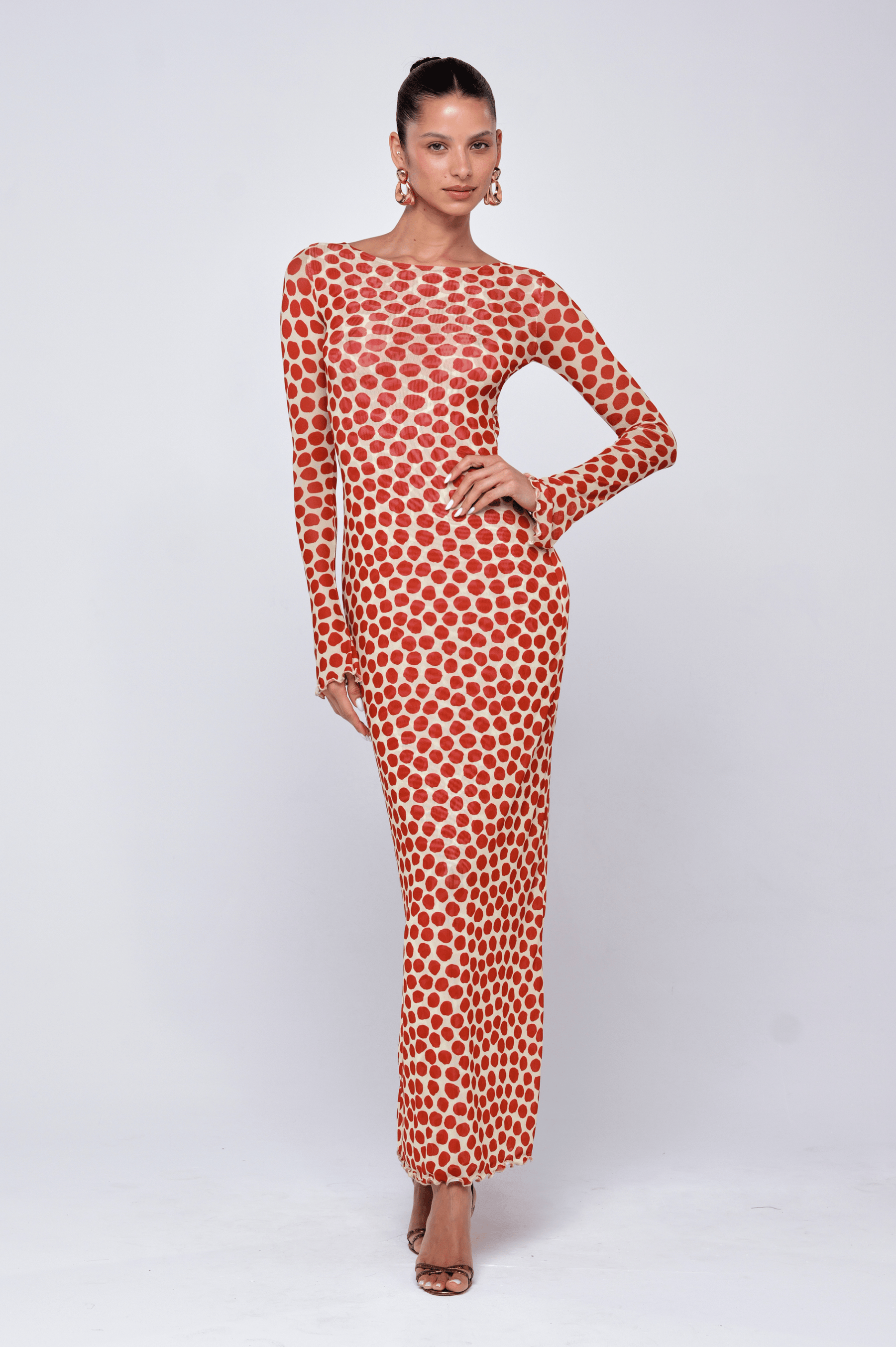 This is an image of Sylvia Dress in Campari - RESA featuring a model wearing the dress