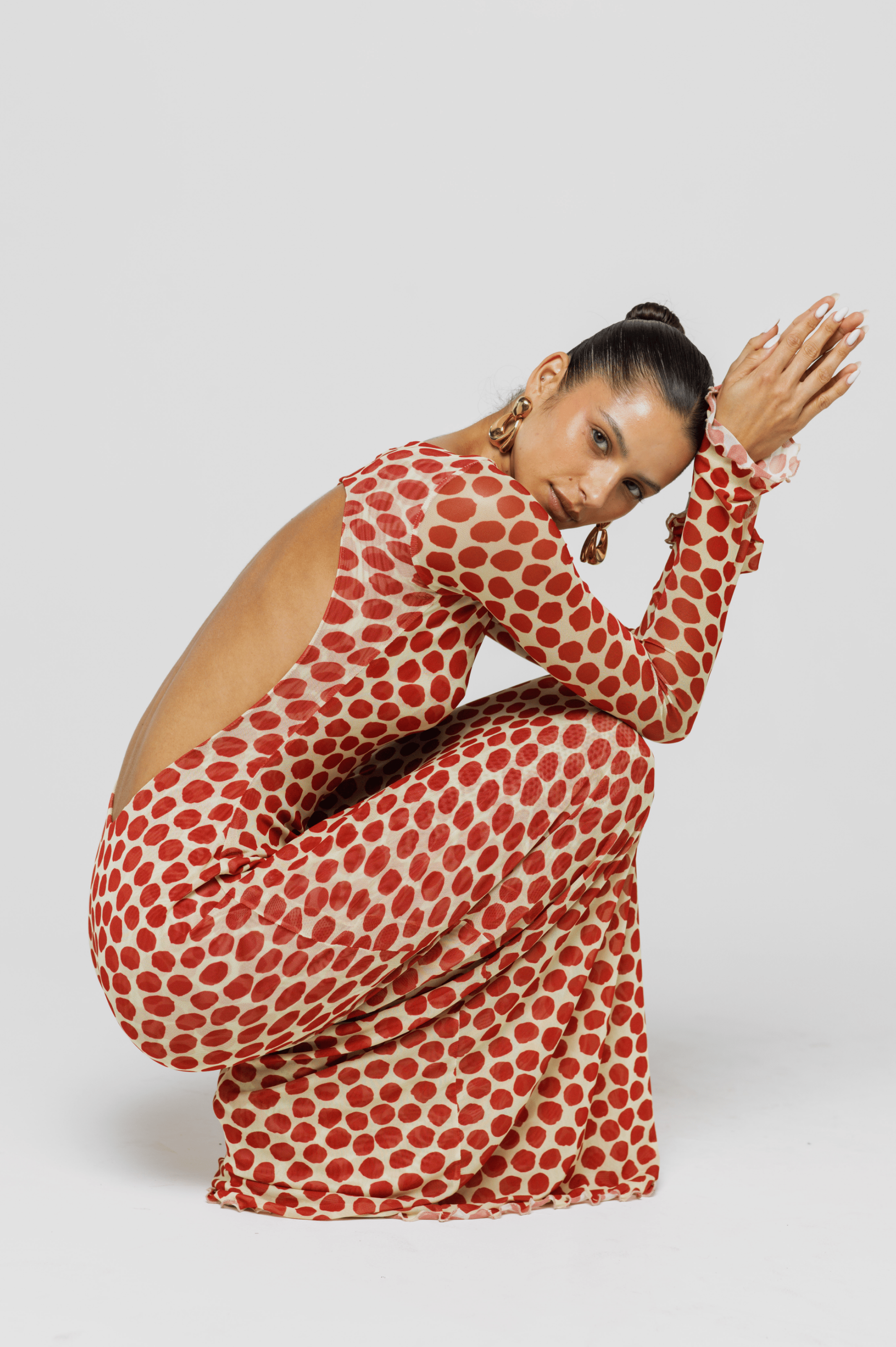 This is an image of Sylvia Dress in Campari - RESA featuring a model wearing the dress