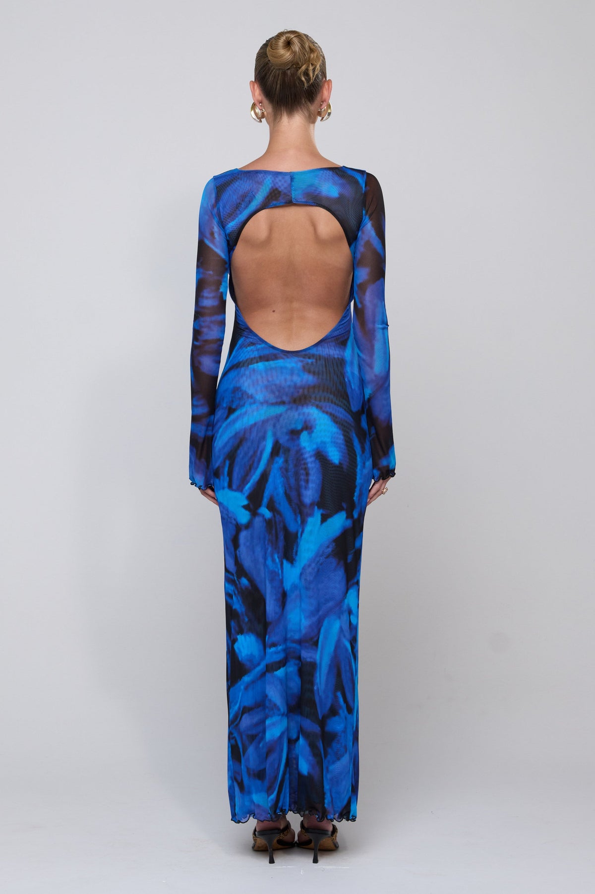 This is an image of Sylvia Dress in Lagoon - RESA featuring a model wearing the dress