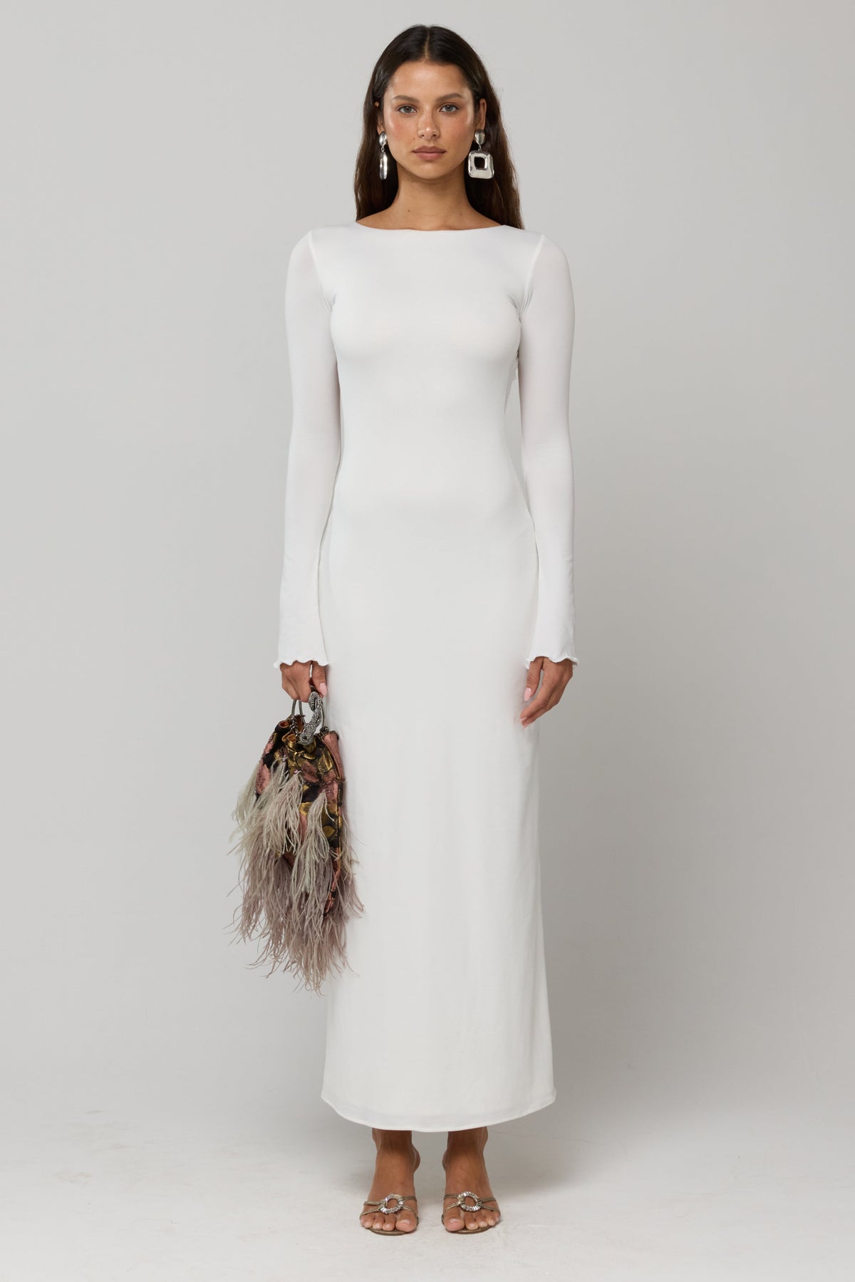 This is an image of Sylvia Dress in White Knit - RESA featuring a model wearing the dress