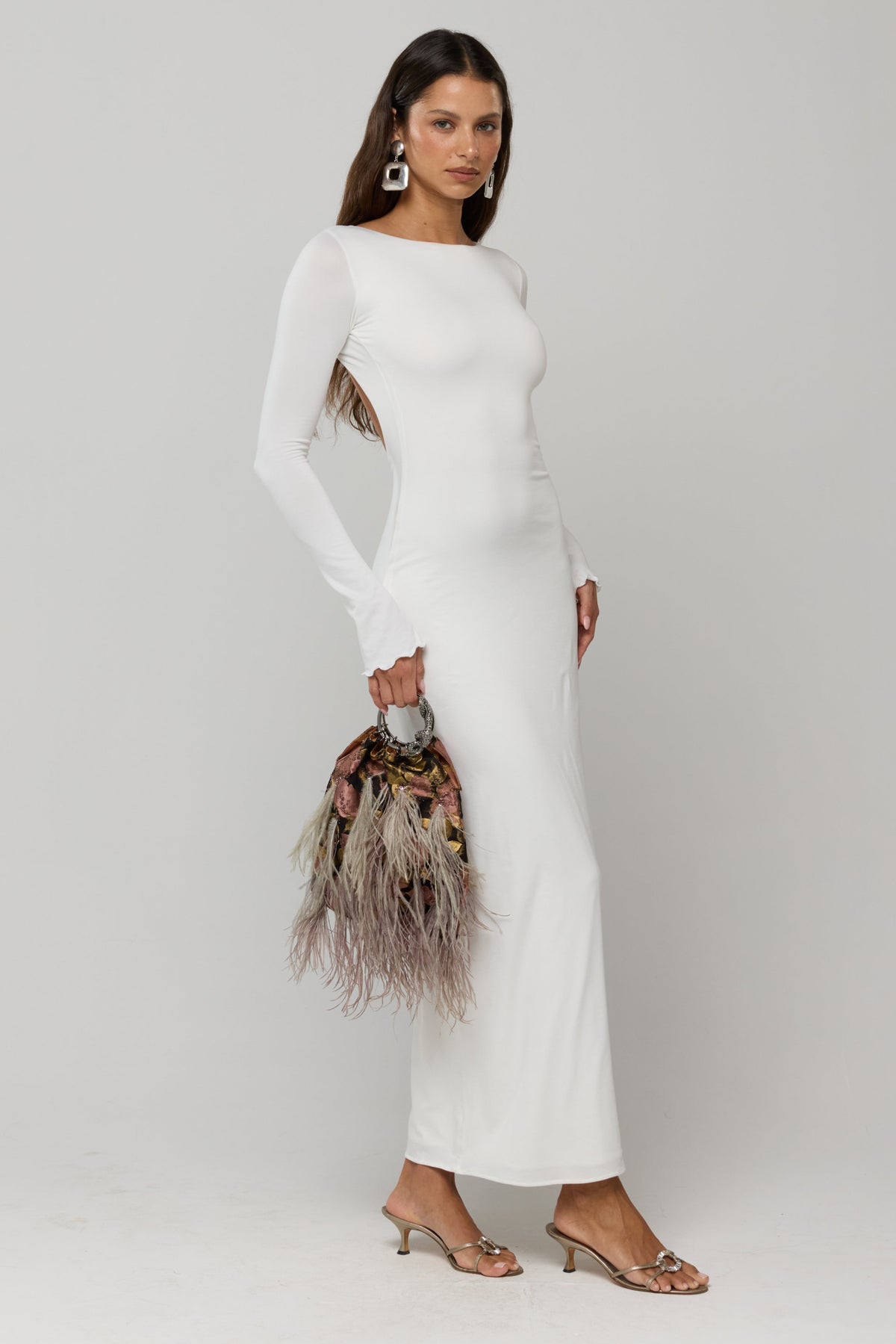 This is an image of Sylvia Dress in White Knit - RESA featuring a model wearing the dress