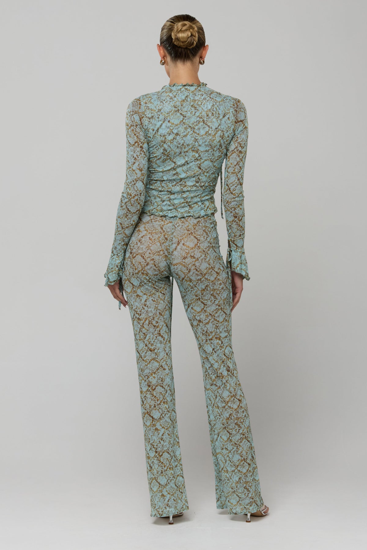 This is an image of Tezza Top in Azura - RESA featuring a model wearing the dress
