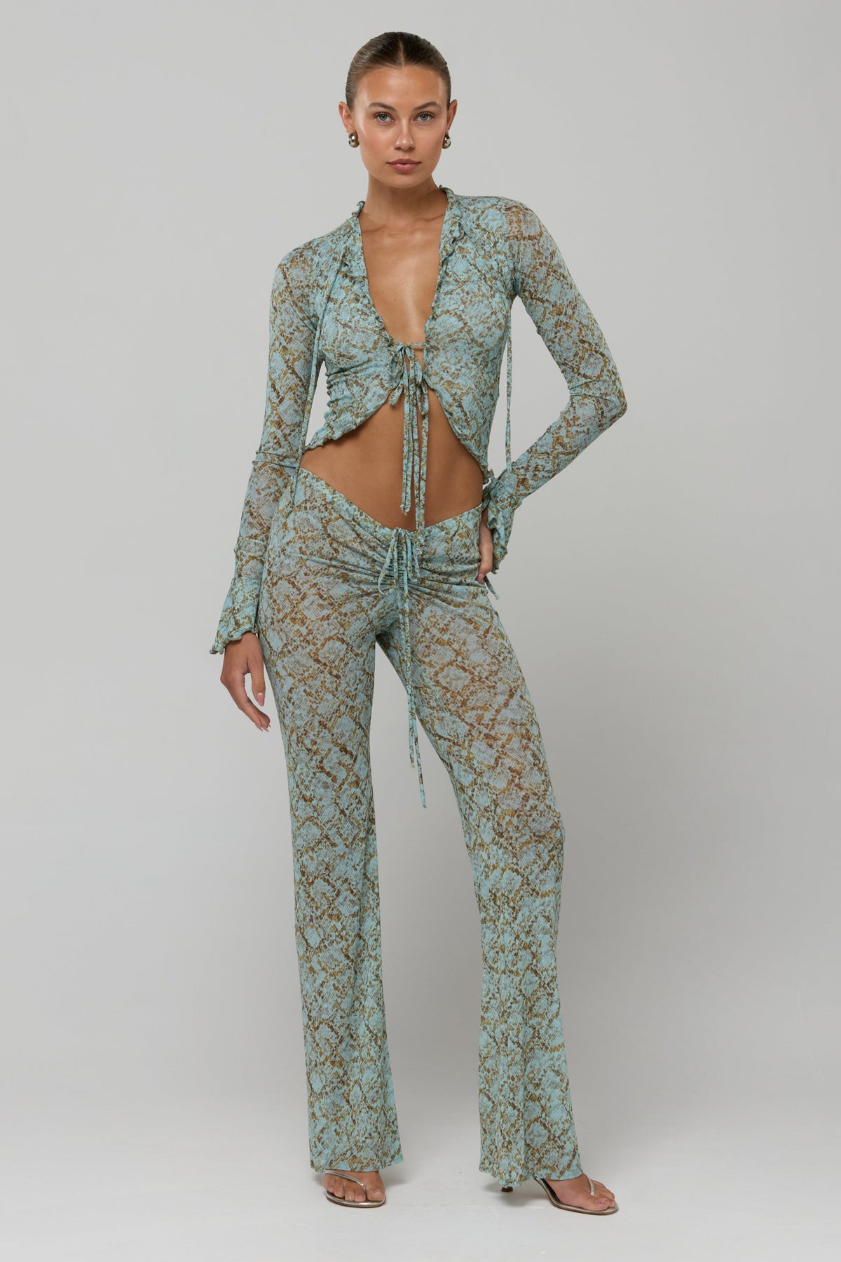 This is an image of Tezza Top in Azura - RESA featuring a model wearing the dress