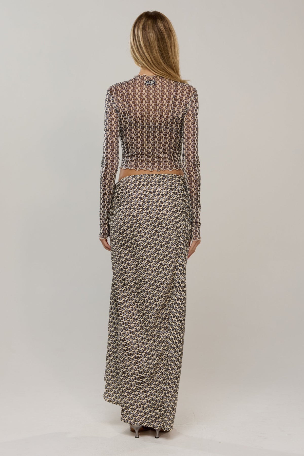 This is an image of Ziggy in Prism - RESA featuring a model wearing the dress