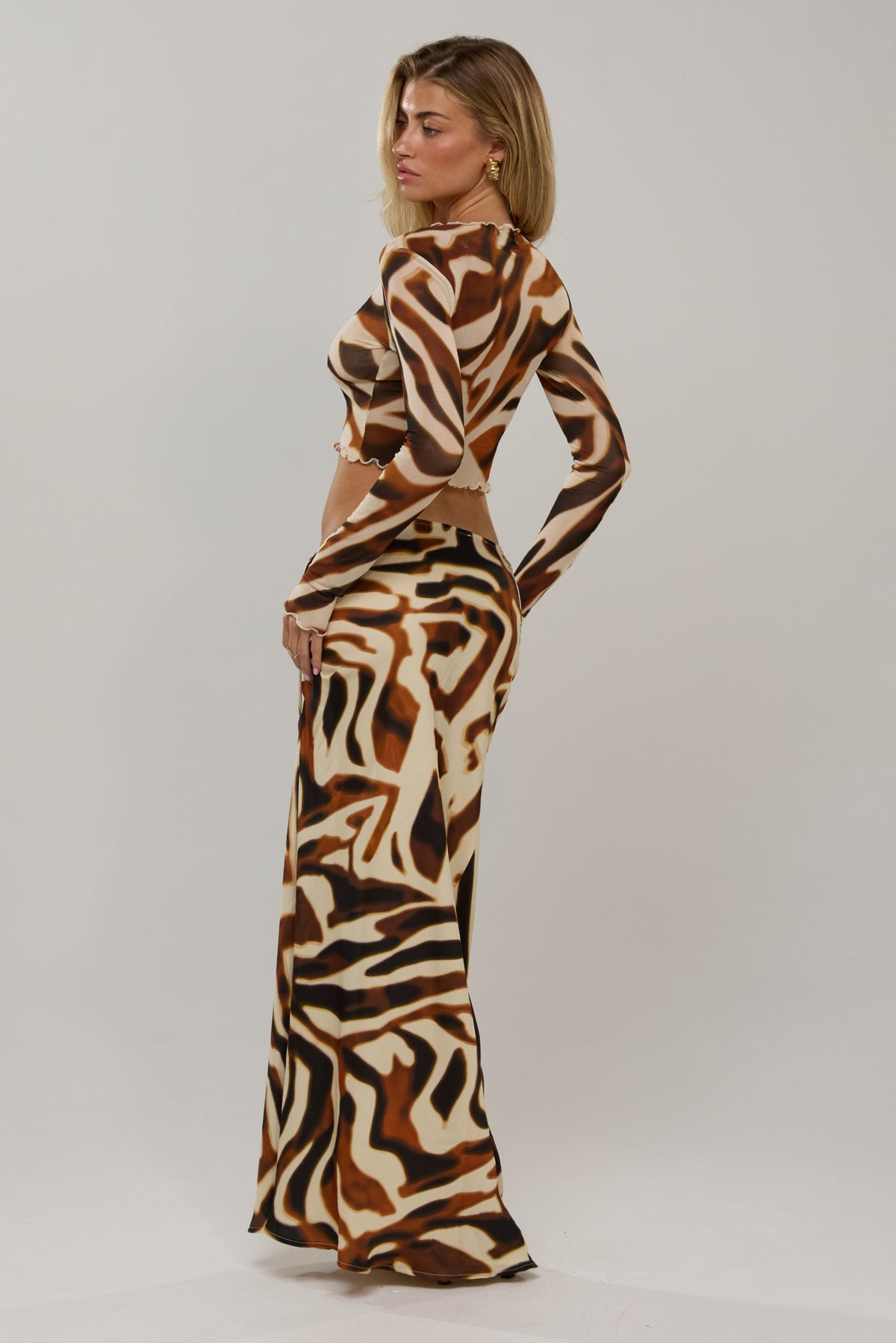 This is an image of Ziggy in Rye - RESA featuring a model wearing the dress