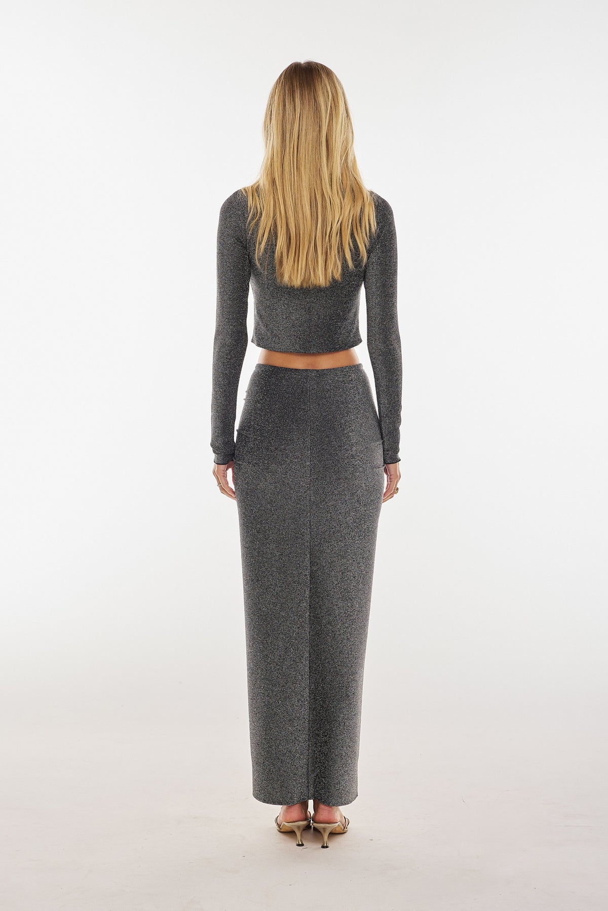 This is an image of Ziggy Skirt in Graphite - RESA featuring a model wearing the dress