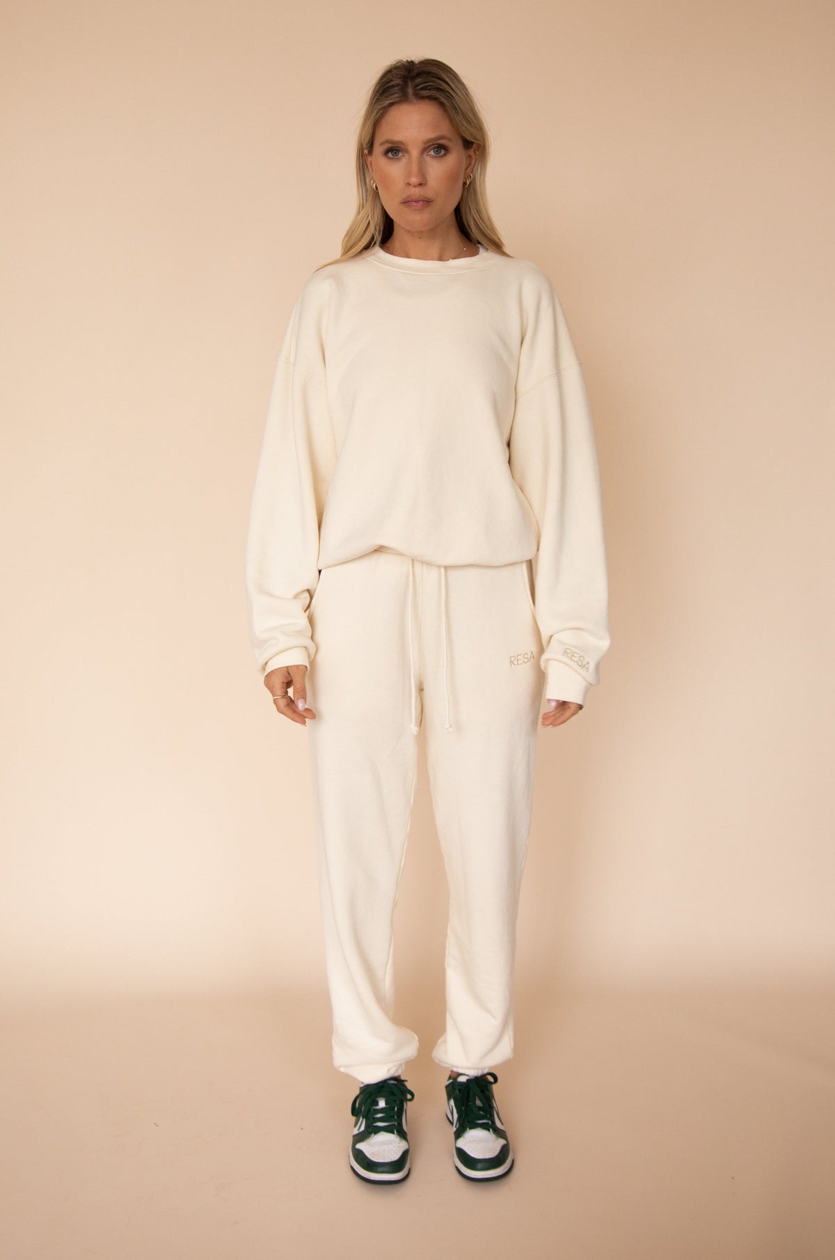 This is an image of Bodhi Sweat pants in Bone - RESA featuring a model wearing the dress